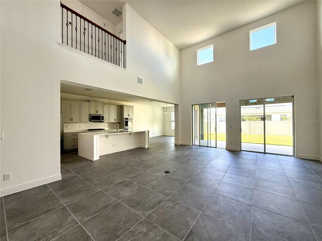 Photo of 394 Switchgrass Loop, Minneola, FL 34715 (MLS # O6363772)