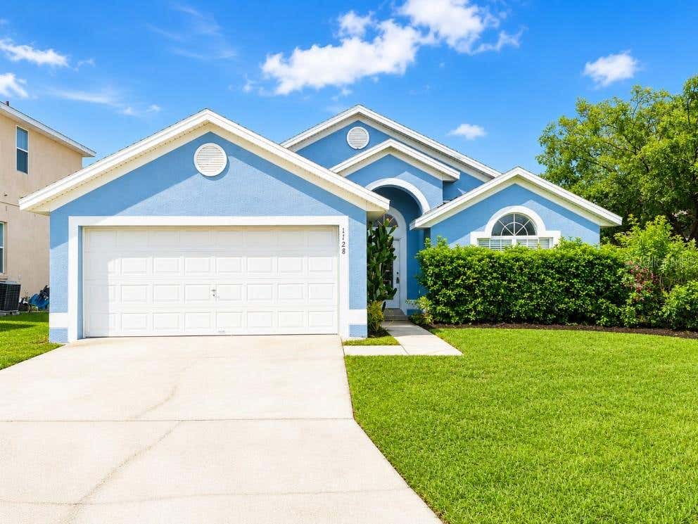 Photo of 1128 Pinedale Drive, Davenport, FL 33897 (MLS # O6433396)