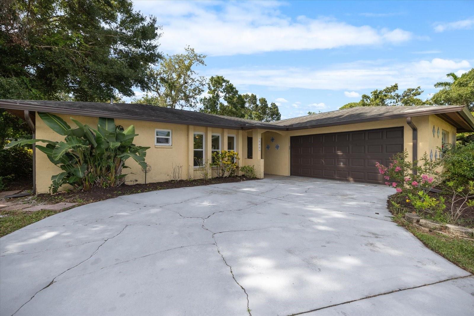 Located in the heart of Sarasota, beyond county flood zones, this pool home sits on an oversized lot with fruit trees and flowering shrubs. Solar panels connected to the grid provide electrical power, and hurricane impact windows offer peace of mind.
The split floor plan features 3 bedrooms, 2 full bathrooms, and a laundry room, with 2 flex spaces that can be used as hobby rooms or office space. Solid surface granite countertops, solid wood cabinets, and stainless steel appliances round out the kitchen, which opens into the dining and living areas. A covered lanai connects to the pool, under a screen enclosure. Look for ceramic tile throughout, fresh paint, and a newer HVAC system. This popular Sarasota neighborhood lies a short drive from Siesta Key Beach, Lido Key, and downtown Sarasota--and minutes from I-75 for quick access to the rest of the Suncoast.