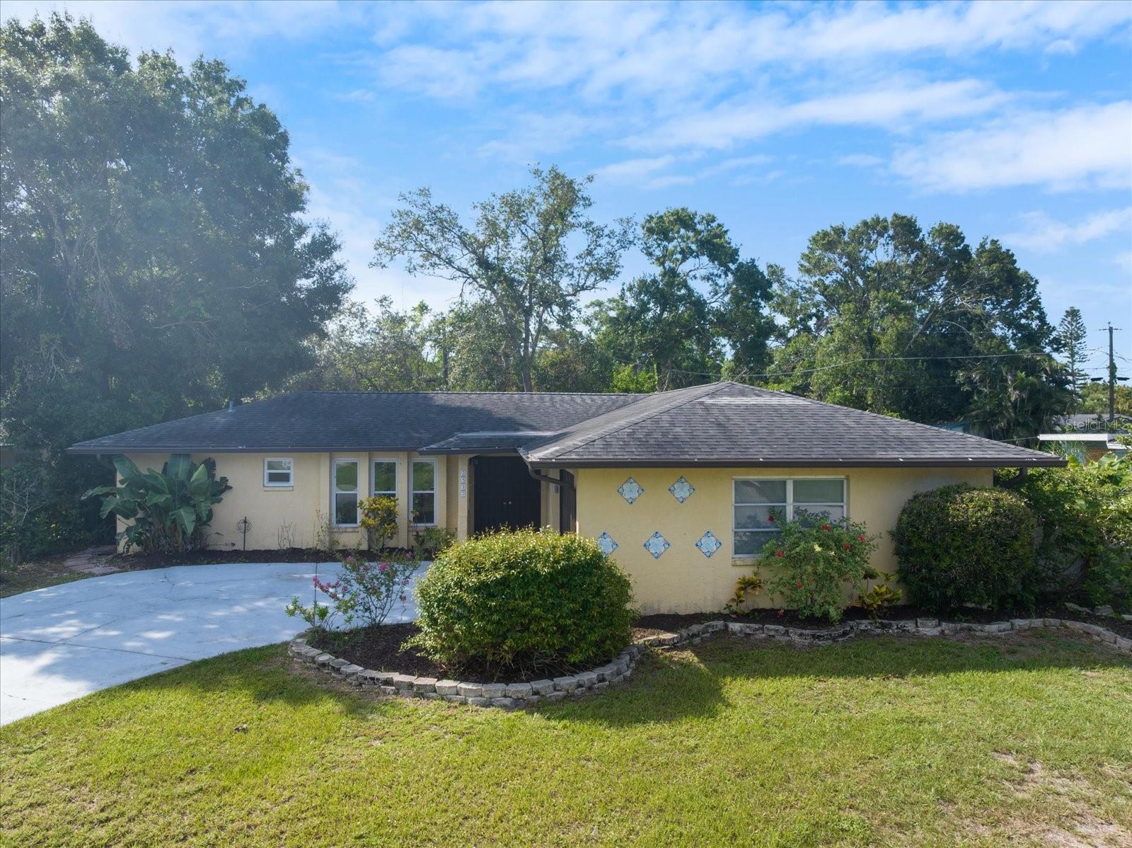 Located in the heart of Sarasota, beyond county flood zones, this pool home sits on an oversized lot with fruit trees and flowering shrubs. Solar panels connected to the grid provide electrical power, and hurricane impact windows offer peace of mind.
The split floor plan features 3 bedrooms, 2 full bathrooms, and a laundry room, with 2 flex spaces that can be used as hobby rooms or office space. Solid surface granite countertops, solid wood cabinets, and stainless steel appliances round out the kitchen, which opens into the dining and living areas. A covered lanai connects to the pool, under a screen enclosure. Look for ceramic tile throughout, fresh paint, and a newer HVAC system. This popular Sarasota neighborhood lies a short drive from Siesta Key Beach, Lido Key, and downtown Sarasota--and minutes from I-75 for quick access to the rest of the Suncoast.