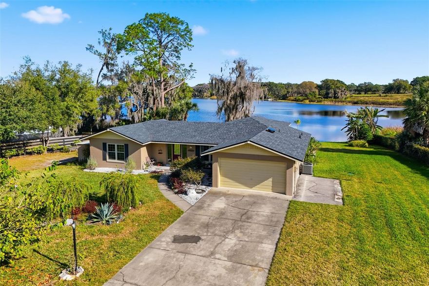 Experience the ultimate in lakeside living with this stunning 3-bedroom, 2-bathroom home situated on the serene shores of Lake Owen in Umatilla, FL. Offering peace of mind alongside luxury, this property features a new roof installed in 2022 and breathtaking scenic views that define Central Florida's natural beauty. Inside, the home boasts a modern split floorplan designed for privacy and flow. The spacious living area is anchored by a cozy electric fireplace, creating a warm ambiance for quiet evenings. The heart of the home opens up to an expansive screened-in rear patio, where you can unwind in your private hot tub while soaking in panoramic lake vistas. 
Whether you are launching a boat from your private dock or enjoying the sunset from your porch, this meticulously maintained Lake Owen retreat offers a rare lifestyle opportunity.