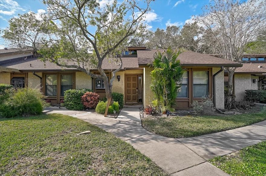 Maintenance-free coastal living awaits in this beautifully updated 2-bedroom, 2-bath condominium located just minutes from the beaches of Anna Maria Island. Set within the serene, wooded community of Pine Bay Forest, this residence offers a relaxed Florida lifestyle paired with modern updates and desirable amenities.

Inside, the open and airy layout is highlighted by vaulted ceilings and abundant natural light. Enjoy new flooring, a redesigned kitchen, and fully renovated bathrooms. The open living and dining areas flow seamlessly, creating a comfortable space for everyday living and entertaining.

The kitchen features contemporary cabinetry, granite countertops, and stainless-steel appliances, with convenient access to the dining area. The primary suite offers a peaceful retreat with dual walk-in closets and an updated en-suite bathroom. A generously sized second bedroom provides flexibility for guests or a home office.

A spacious screened lanai extends the living space, offering both a sitting area and additional storage. Additional features include in-unit laundry, an assigned carport, extra storage closets, and ample guest parking.

Pine Bay Forest is a lushly landscaped community offering residents a pool, spa, tennis and badminton courts, and a private dock ideal for enjoying sunsets on the bay. Conveniently located near beaches, shopping, dining, and recreational opportunities, this property provides a perfect balance of tranquility and accessibility. A wonderful opportunity to enjoy updated, low-maintenance living in a prime coastal location.