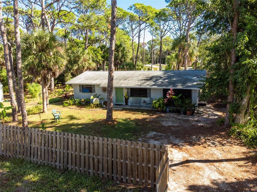 UNIQUE HOMESTEAD IN THE HEART OF OLD ENGLEWOOD VILLAGE!
Private, nature-lover’s retreat tucked in 100' from road frontage, and on a beautiful oversized lot within easy walking distance to the weekly Farmer’s Market, The Open Studio, Downtown Dearborn's quaint cafes, artisan studios. Walk to all the best parks on Lemon Bay, and enjoy sunsets and kayaking on the water.    MANY RECENT RENOVATIONS include LUXURY VINYL TILE throughout  home,  a chef's delight very spacious all-new kitchen, featuring pull out drawers, ample solid surface counter space and solid wood cabinets.  New 12x18’ lanai with a new composite roof, offers  peaceful nature views, quality large shed and fencing, and insulated hurricane garage door as well as impact 6’ sliding door. Newer roof, water heater, AC, and plumbing and electrical upgrades. Generous bedrooms with large closets. One of the bedrooms has an exterior entrance and kitchenette. Bring your creativity - this home is set up for flexible multi-use rooms, including wonderful studio space and rental income potential. Owner has planted many fruit trees, and brought colorful charm to the home. Per Sarasota County- Article 7, Special Zoning Districts Standards, This property is zoned within the RCTOD ( Residential / Commercial Transition Overlay), intended to further the goals, objectives and policies , such as home-based office, art gallery, artist studio, and bed and breakfast establishments, as well as low intensity office, professional, and institutional uses. The mixed use component will allow office spaces in residences and residential dwellings above or behind shops. Per FEMA Sarasota County this property will be in X flood zone designation as of 2024