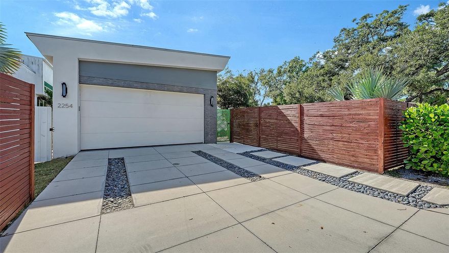 LOCATION! LOCATION! LOCATION! This beautiful contemporary home is conveniently located 2 blocks from the hospital and a few minutes from downtown Sarasota. Newly built in 2018, the residence features 3 bedrooms, 2.5 baths, a gigantic lanai, soaring ceilings, expansive windows, and an abundance of natural light that fills the open-concept layout with an airy, inviting ambiance. High-end cabinetry and sleek finishes enhance the sophisticated interior, while a versatile second-floor loft offers endless possibilities for a home office, fitness area, art studio, or guest retreat. Built above the flood zone and outfitted with hurricane-impact windows and doors, the home offers both beauty and long-term peace of mind.  The fully fenced, lush yard provides privacy and is ideal for pets. You will enjoy your walk around Arlington Park and the vibrant Southside Village.