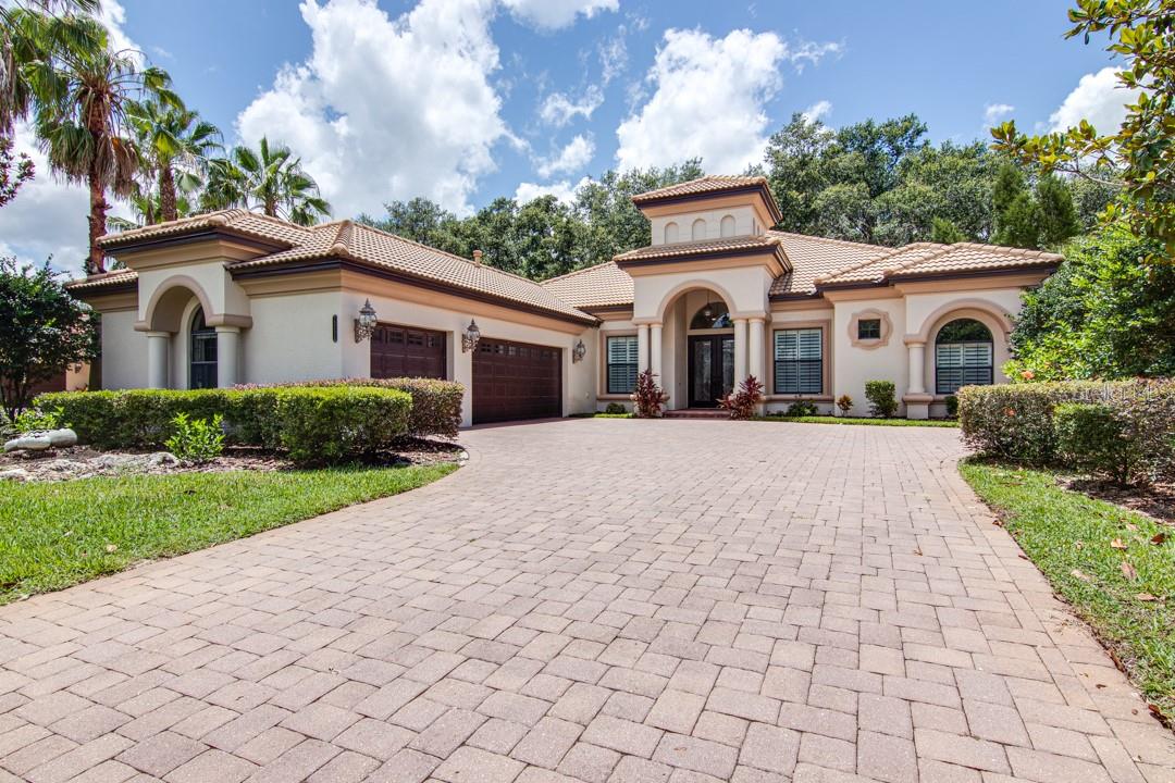 Beautiful luxury Arthur Rutenberg single story pool home on a private conservation lot in one of New Tampa / Wesley Chapel’s premier manned guard gated communities of Grand Hampton, surrounded by other million dollar homes. This nearly 3,300 square foot home features 5 bedrooms PLUS office / 3 full bathrooms / 3 car garage / Pool and Spa with new heater / Huge screened lanai and so much more. This home must be seen to appreciate all that it has to offer. Dramatic high volume ceilings invite you into the home from the spacious entryway, including fine craftsmanship such as tray ceilings, crown moulding, open concept floor plan, and a large kitchen great for entertaining. All the advantages of single story living with plenty of separation and privacy for all members of the household and guests. Open floor plan is perfect for entertaining and incorporates indoor/outdoor space as true Florida living! Grand Hampton offers world class amenities which you can walk to – 2 pools, tennis courts, basketball courts, gym, clubhouse, and parks and playgrounds. Regular community events encourage an active social life within Grand Hampton. All of this while being minutes to the interstate and popular and growing Wiregrass area of Wesley Chapel including Wiregrass Mall, restaurants, breweries, malls, ice rink, new hospitals, and so much more! Don’t miss this opportunity!