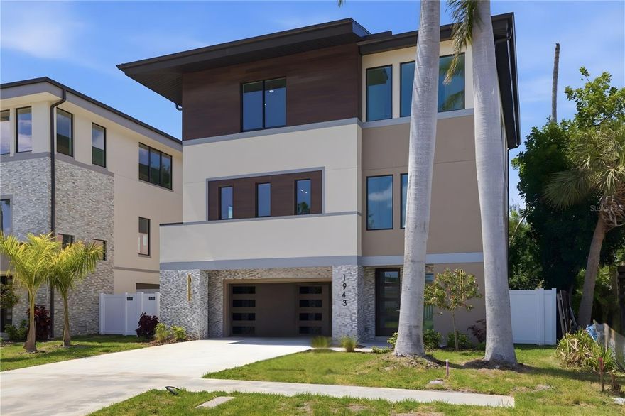 ELEVATED NEW CONSTRUCTION IN SHORE ACRES WITH MAIN LIVING AT 14 FEET ABOVE BASE FLOOD ELEVATION, IMPACT WINDOWS AND DOORS, ELEVATOR, AND A POOL SIZED BACKYARD IN ONE OF NE ST PETERSBURG’S MOST DESIRABLE LOCATIONS

Completed in 2024, this 4 bedroom, 3.5 bath elevated home offers approximately 3,005 heated square feet and is built to current code for improved insurability and long-term durability. The main living level is elevated to 14 feet above sea level, well above the base flood elevation, and includes engineered flood vents at the ground level enclosure, providing a thoughtful approach to construction and peace of mind.

The ground level includes an oversized two car garage with epoxy flooring, 10 foot ceilings, additional storage, and direct access to the home, along with elevator access to all levels. The main living area is positioned above the garage and features an open floor plan with 10 foot ceilings, 8 foot doors, and a large covered balcony off the living and dining areas, creating a natural extension of indoor and outdoor living.

The kitchen is designed for both everyday use and entertaining with Eurocraft cabinetry, quartz countertops, a Bosch appliance package, walk in pantry, and a large island ideal for gatherings. Interior finishes include luxury vinyl plank flooring, walk-in showers, Swiss Madison toilets, bronze finishes, and closet organizers throughout.

The upper level includes a private primary suite with walk-in shower, soaking tub, and double vanity, along with a loft or den space and a conveniently located laundry room. The floorplan is designed to provide open shared spaces while maintaining separation for privacy and flexibility, including a main level 4th bedroom, den, or home office.

Outdoor features include a covered ground level lanai with electric ready for a future outdoor kitchen, a fully fenced backyard, and space for a pool. Sliding doors connect the main living space to the balcony, enhancing natural light and airflow.

Located in Shore Acres, one of Northeast St Petersburg’s most established neighborhoods, this home offers convenient access to Downtown St Petersburg, waterfront parks, and Tampa Bay. Nearby amenities include Shore Acres Recreation Center, Speer YMCA, Mangrove Golf Course, Denver Park with tennis, pickleball, volleyball, and softball, as well as playgrounds, fishing areas, and walking paths. Everyday shopping and dining options, including Publix, Whole Foods, Fresh Market, Trader Joe’s, Starbucks, and Target, are all within a short drive. Nearby schools include Shore Acres Elementary, Mangrove Middle, St Petersburg High, Shorecrest, and Canterbury.