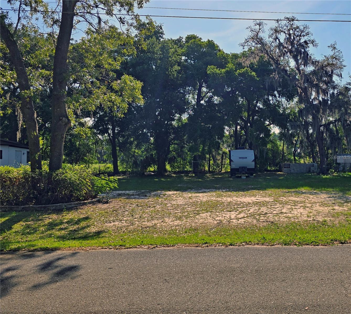 NO lot rent, No CDD, NO HOA and No rear Neighbors! Level cleared site. Located minutes from Ocala and the World Equestrian Center, shopping, dining, and medical facilities and a short drive to The Villages with its free nightly entertainment at the squares. You're a quick trip to Florida’s major theme parks and only about an hour and a half from both the Atlantic and Gulf coasts. Also available for sale, vacant lot at 16055 SE 99th (MLS G5097318). Call today to schedule your private showing and Let’s make a deal!
