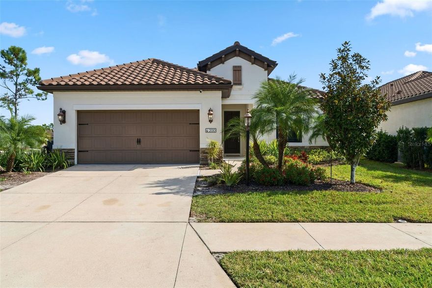 Welcome home! This 2018 Neal-built residence is located in the gated community of Milano in Nokomis— close to both Venice and Sarasota. This three bedroom + den, two and a half bathroom home is situated on a desirable corner lot with no neighboring homes across the street or to one side of the residence—providing a more open and spacious feel to the exterior of the home. As you enter the home, you are met with designer-selected wood-look tile flooring throughout the main living areas and carpet in the three bedrooms. The kitchen features an abundance of cabinet, countertop, and pantry space for the chef of the home to utilize and enjoy. Quartz countertops with a complementing backsplash, a farmhouse sink, stainless steel appliances (gas stove), and pendant lighting can all be found in the kitchen area which is open to the dining room and great room. In the great room you will notice a tray ceiling with recessed lighting, a ceiling fan, and “behind the wall wiring” to mount a TV. The screened lanai overlooking your fenced backyard is the perfect spot to enjoy your morning coffee/afternoon cocktail with room to expand this space if desired. The formal dining area enjoys plenty of light from the numerous windows. The primary suite located at the back of the home offers privacy and includes an oversized walk-in shower, dual sinks, cultured marble countertops, two walk-in closets, and a tray ceiling. The two guest bedrooms share a bathroom with a shower/tub combo. The home has a HUGE dedicated laundry room complete with a sink and storage cabinets. The half bath offers convenience when entertaining at home. The den at the front of the residence includes French doors and is an ideal spot for an office, additional TV room, or home gym. Plenty of storage can be found throughout the home with numerous storage closets. The property includes an alarm system and other smart features such as a smart door lock, thermostat, cameras, and lights. This home is also equipped with a water filtration system for the entire home. For peace of mind during storm season, the entire home is equipped with hurricane shutters. Located in an X flood zone so no need for flood insurance. Milano is a gated, resort-style, natural gas community, with top-tier amenities including a heated pool & spa, clubhouse, outdoor pavilion, tennis/pickleball courts, dog park, and bocce. There is even a lifestyle director on staff to organize events for the community. The HOA is just $543.16 per quarter and pays for the amenities, various activities, landscaping of the common areas, and community gates. There is NO CDD fee in this community and this home is located in X flood zone— so no flood insurance needed. Owners may rent their property on a six-month minimum lease period. Publix grocery store is 2.6 miles away, Venice Island/downtown Venice 6.5 miles, downtown Sarasota 17 miles and your choice of Venice and Nokomis beaches are 7 miles away with other beach options just a few miles further. Venice Island is known for its beaches, shopping, dining, splash pad, parks, playgrounds, fishing pier, tennis courts, weekly farmer’s market, tons of events, and so much more! Schedule your showing today and start living the Florida lifestyle! (See floor plan in photos.)