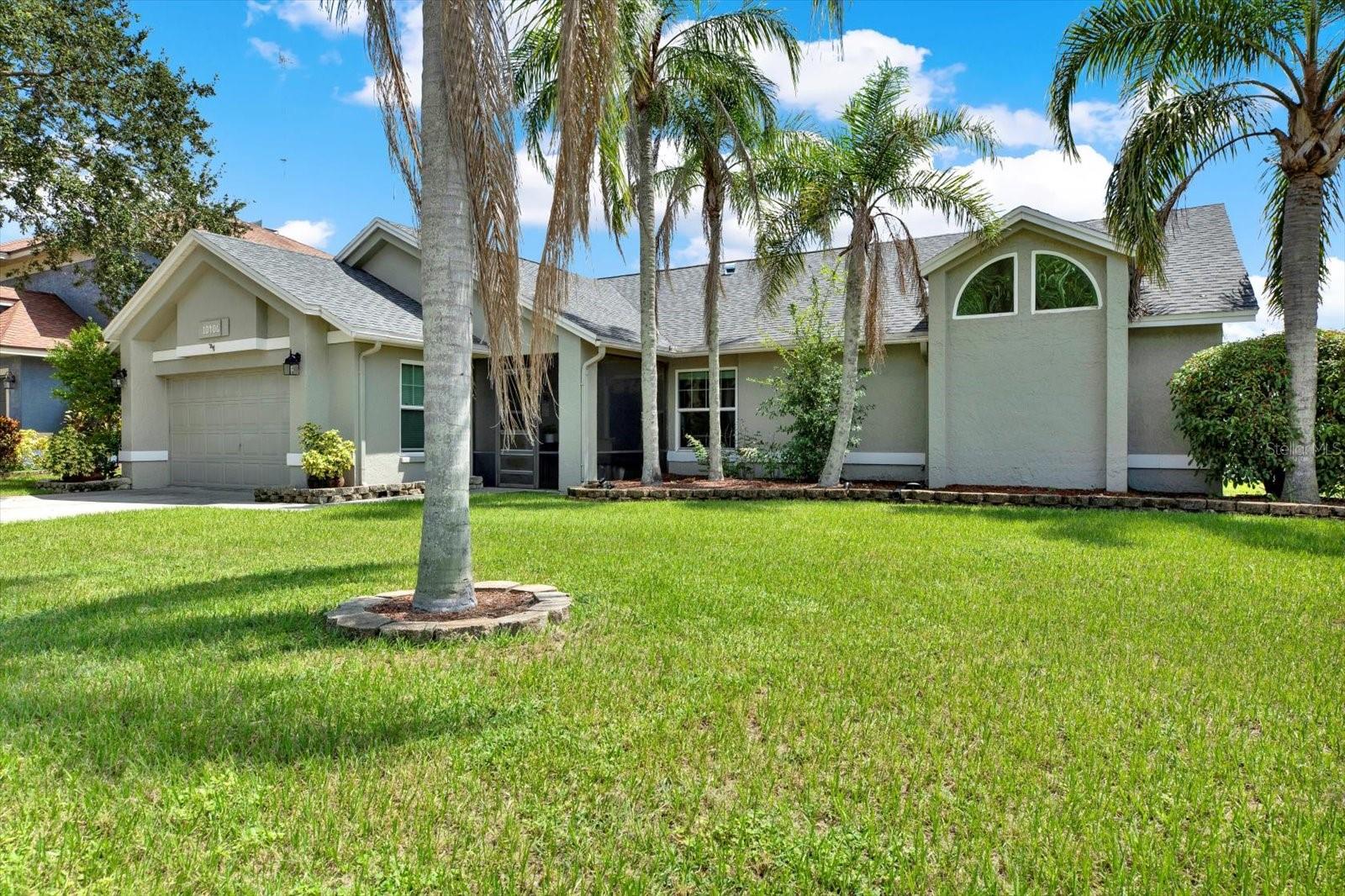 BEAUTIFUL POOL HOME with serene pond views in Boyette Springs and NO HOA! Step outside and enjoy Florida living at its finest with a sparkling pool, spacious pool deck, and a large covered patio perfect for entertaining family and friends. Sliding doors provide flexibility to enclose the area, while a separate screened patio off the guest bedroom adds another relaxing retreat. A cozy front screened entry welcomes you into this 4-bedroom, 2-bath split floor plan.
Inside, the kitchen has granite countertops, stainless steel appliances, and three pantries for maximum storage. The remodeled second bathroom is equipped with modern finishes, while the primary suite offers a vaulted ceiling, updated accent wall, two closets, and a granite-topped dual vanity. Crown molding adds an elegant touch throughout the home.
Additional features include:
Bonus A/C room in garage – perfect for extra storage, crafts, or office space
Freshly painted exterior (2023)
Roof (2022)
HVAC (2019)
Water heater (2024)
Mature palm trees enhancing curb appeal
Can be used as short term or long term rentals with no years of ownership required!!
This home blends comfort, style, and peace of mind with its many updates—ready for its new owners to enjoy right away!