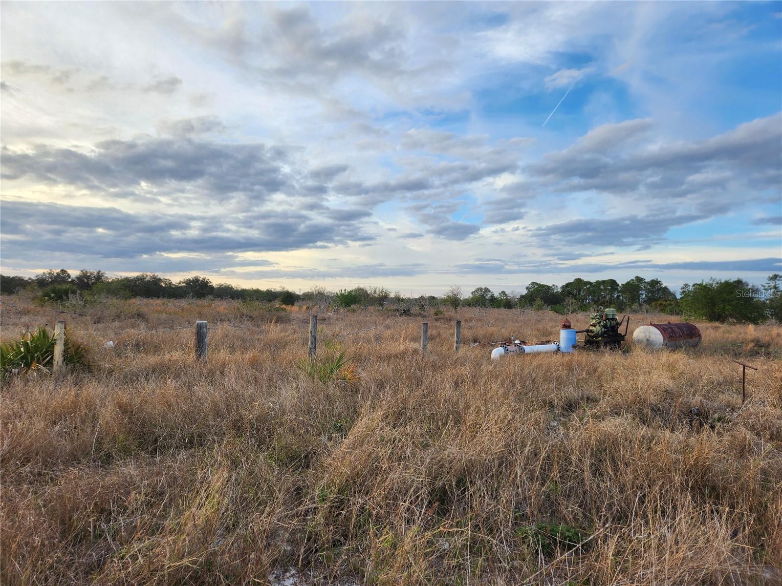 40K PRICE REDUCTION. SELLER Motivated. Build your dream home on this spacious 9.47-acre lot with 50 feet paved road frontage in the peaceful Oakridge Estates community! Located in Frostproof and zoned for residential use, this high-and-dry parcel offers flexibility with no HOA. Surrounded by open countryside yet just minutes from town, the property has electric nearby; well and septic are needed. Ideal for those seeking privacy, space, or future growth potential. Adjoining parcels are also available, offering the opportunity to acquire nearly 50 contiguous acres—purchase individually or as a package. GPS Coordinates: 27°43'24.6" N, 81°34'31.8" W