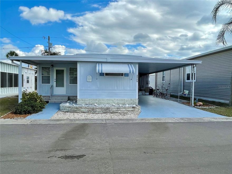 2 beds, 1.5 bath home with a large enclosed Florida room, seller has taken good care of this home, and enjoyed since 2005, but it is time to move on! A completely TURN KEY home, just MOVE RIGHT IN, it has a very comfortable setting, nicely furnished with a good size screen lanai, and a over-sized laundry/workshop SHED. Main bathroom and the 1/2 bath have both been nicely updated. Laminate flooring through-out, only carpet in the 2 bedrooms... A couple of the windows have already been replaced, home is painted and as I said, 'ready to move in'. HVAC - 2021... Sunset Palms is in close proximity to the beaches, airports, I – 275, churches, restaurants, all kinds of shopping, etc.… This park is 1 of Pinellas County‘s best kept secret in my opinion, very inexpensive living at ONLY $183.05 per month which includes all the amenities one could want; WATER, SEWER, and TRASH, owned clubhouse, escrows are fully funded, beautiful heated pool and spa, fitness center, library, shuffleboard, billiard table, laundry room, and your very own private entrance to the super Walmart… on foot, bicycle or golf cart… Etc., etc.****** THIS HOME IS PRICED TO SELL! *******