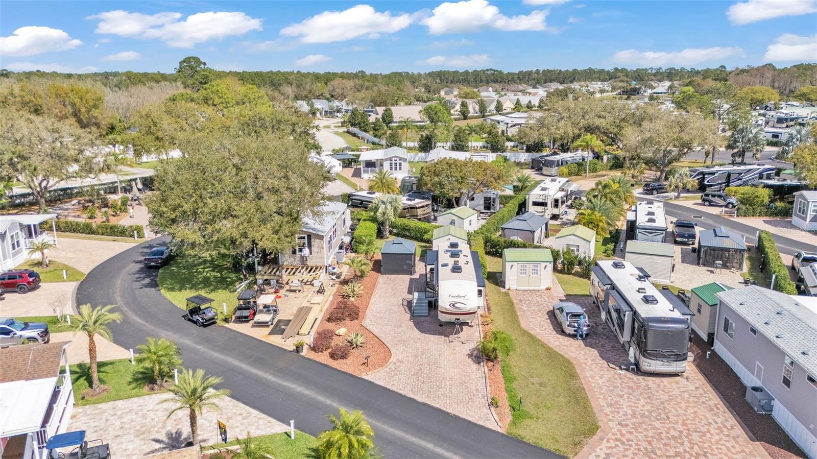 Welcome to your Florida RV Oasis in Elite Resorts at Citrus Valley! This spacious lot and pad features low maintenance landscaping, shady gazebo and a 10x12 FINISHED shed. Citrus Valley is a top notch RV resort, located in Clermont just 12 miles from Disney World! In this sought-after part of Citrus Valley (known as "The Oaks"), the lots are especially large and scenic. Imagine relaxing under your 10x12 hard top gazebo with overhead lights & special privacy screens, enjoying good conversation. Or perhaps a swim in the community pool is on the agenda followed by happy hour with friends in the clubhouse. On Cherry Tree Court, your RV will sit on a spacious paver pad of over 2400 square feet, hooked up to 50 amp electrical service with water supply and sewer services. The storage shed creates additional living space- with drywall, vinyl floors, power, direct wiring for cable/internet, window AC unit, sofa, desk, storage cabinets refrigerator, lighting and window treatments. It’s perfect as an office, “she-shed,” retreat or TV room! There is a lush hedge bordering the lot and green space behind for dog walking or privacy. This property also has river rock in the flower beds, irrigation and solar landscape lighting. Citrus Valley offers many amenities including two resort bath houses, laundry facilities, Bingo, a Veteran's group, variety entertainment shows and social events. The lawn is cut regularly by the association and your HIGH SPEED INTERNET, cable, sewer, water and trash pick-up are all included in your quarterly Condo dues of $756. Low maintenance living leaves you plenty of time to enjoy all the local attractions. If you ever sell your RV, you can have a park model installed on your site. The possibilities are endless on this special lot! Call today and set up your showing.