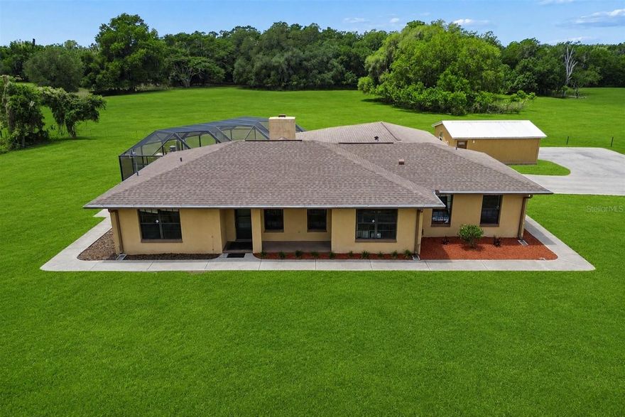 Welcome to your own private retreat, where country living meets everyday convenience on just under 1.25 acres. This 3 bedroom, 2 bath pool home offers a rare combination of space, flexibility, and functionality. The property features a detached in-law apartment complete with its own private bathroom, ideal for guests, multi-generational living, a home office, or additional income potential.
Inside, the home offers a warm and inviting layout highlighted by a cozy fireplace and comfortable living spaces designed for both everyday living and entertaining. Step outside to enjoy the pool, expansive outdoor space, and peaceful setting that provides privacy while still being conveniently located near shopping, dining, and major roadways. Additional highlights include a newly paved driveway, ample room for parking, and endless potential for those seeking a property with room to spread out and enjoy the Florida lifestyle.