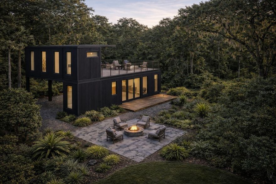 Under Construction. Thoughtfully designed modern retreat emphasizing light, flow, and connection to its surroundings. This architecturally distinctive home displays approximately 849 sq ft of interior living space complemented by over 1,200 sq ft of decks, rooftop terrace, and outdoor living areas, creating a seamless indoor–outdoor experience.

Built using engineered container-based steel construction and fully permitted to meet traditional residential building codes, the home combines durability with clean modern design. Extensive impact-rated glazing, high ceilings, and an open layout bring natural light throughout the interior while framing views of the surrounding wooded landscape.

Located in Georgetown Cove near Lake George, this setting provides privacy, access to nature, and convenient reach to both Florida coasts—well suited as a full-time residence, second home, or warm-weather retreat.