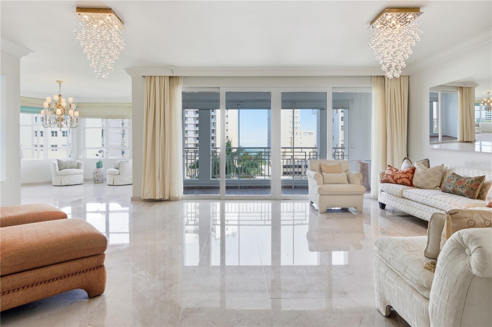 Discover one of the most elegant residences in the exclusive Marymar condominium—where the sophistication of Condado meets the laid-back charm of Ocean Park. Located on the 6th floor of this full-service, boutique building, this exquisite apartment offers the rare blend of elegance, space, and ocean views in one of San Juan’s most walkable neighborhoods.
Refined marble floors and high-end finishes elevate the interiors, while beautiful bay windows in the dining and primary bedroom areas invite natural light and frame serene views. A north-facing balcony captures both the energy of McLeary Street and stunning ocean vistas. The current layout offers generous proportions and can be effortlessly converted into a 3-bedroom residence to suit your lifestyle needs.
Exceptional storage is a hallmark of this home, with generous built-in closet space, plus two additional deeded storage units outside the apartment—ideal for seasonal items, beach gear, or sporting equipment. Two dedicated parking spaces provide convenience and peace of mind in this vibrant urban setting.
Marymar offers full backup generator coverage, 24/7 security, and professional management—delivering a level of service and tranquility that is unmatched in the area.
This is truly the finest property available in this coveted coastal corridor, where everyday living is elevated by ocean breezes, tree-lined streets, and proximity to top restaurants, parks, and beaches—all just steps away.