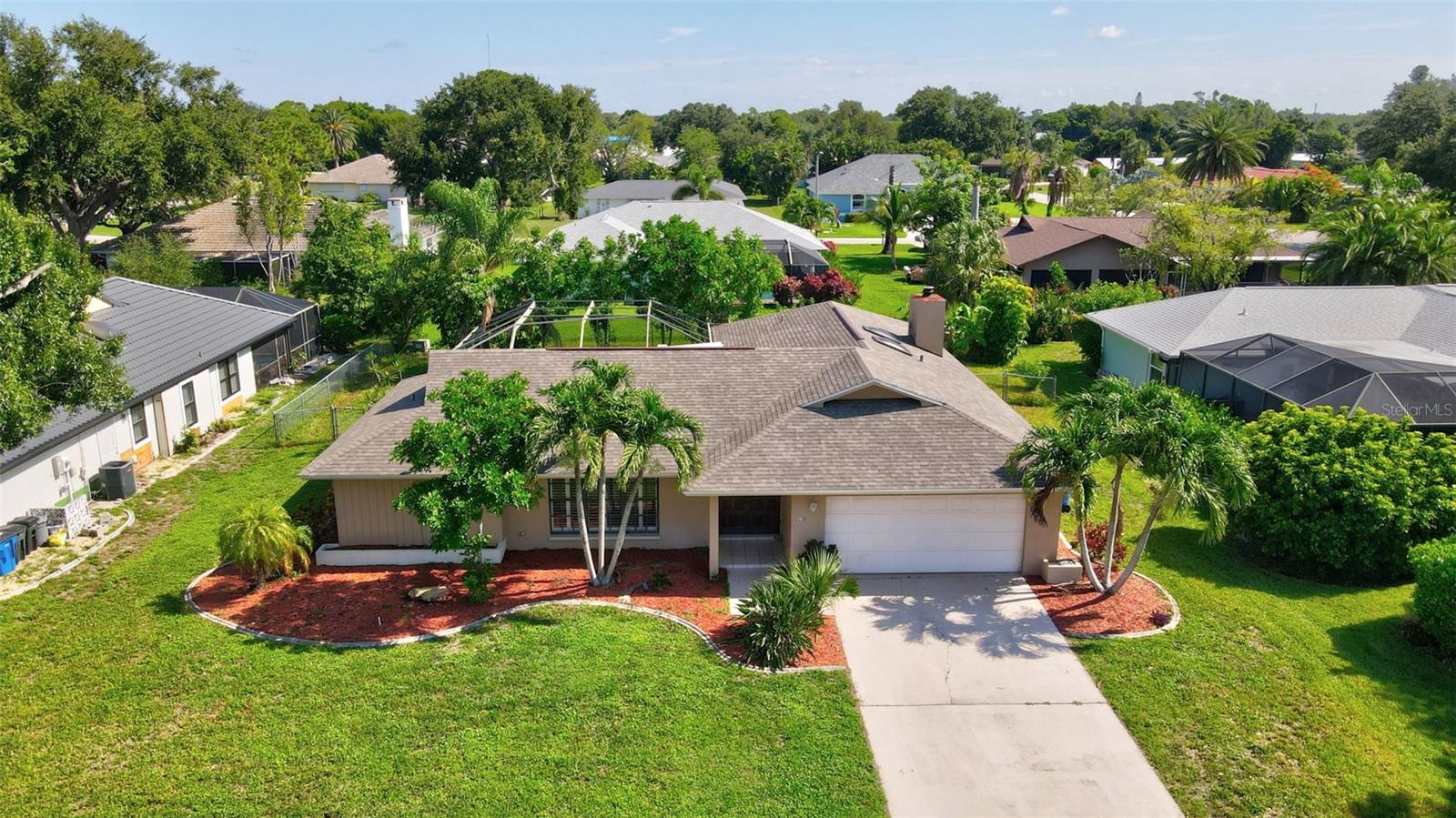 Large POOL home in desirable LOCHMOOR!
Beautiful 3 /3 with separate living room, dining room, family room and eat-in kitchen; Gorgeous solid wood double entry doors; Soaring open beam vaulted ceilings with twin skylights, custom tray ceiling in kitchen; Large master bedroom with direct access to the to the pool area, dual sinks in the master bathroom; huge fiberglass pool with over-sized screened cage, pool area has large lanai with a convenient pool bath; walk-in closets; Lots of tile floors; Finished garage with epoxy finished floor; Brushed nickel ceiling fans (some with remote controls) and light fixtures; Exotic tropical landscaping, red mulch & lava rock & concrete curbing that surrounds the ENTIRE home; New Roof, band new pool pump; security system. Located near shopping, dining, healthcare facilities and Downtown Cape Coral and Fort Myers. AWESOME!!!