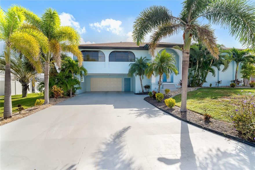 Don't miss this exceptional opportunity to own a spacious, move-in-ready, and meticulously maintained coastal home with direct, no-bridge access to the Intracoastal Waterway and stunning Stump Pass! This beautifully designed 3-bedroom, 3.5-bath residence offers the ultimate Florida lifestyle. Enjoy your own private swimming pool and hot tub, surrounded by a serene backyard oasis filled with swaying palm trees and natural beauty. Boating and fishing enthusiasts will love the covered boat lift, making it easy to hit the water anytime. Each bedroom features its own en-suite full bathroom, providing privacy and comfort for family and guests alike. The open-concept floor plan creates a bright, inviting atmosphere, the kitchen layout is perfect for cooking while entertaining your guests and everyday living. Car lovers and entertainers will appreciate the two-car garage plus an additional two-car carport, ideal for extra vehicles, a boat trailer, or hosting gatherings. The lower-level bonus area offers flexible space for hobbies, storage, or recreational use. Located just minutes from pristine beaches, turquoise waters, and endless island-hopping adventures, this home offers a rare blend of comfort, convenience, and coastal charm. Schedule your private tour today and start living the waterfront lifestyle you’ve always dreamed of!
