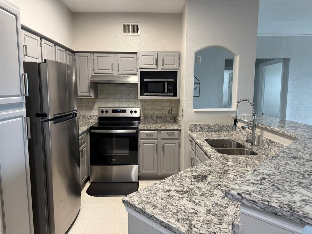 Photo of 3384 Corona Village Way #202, Orlando, FL 32835 (MLS # O6453257)
