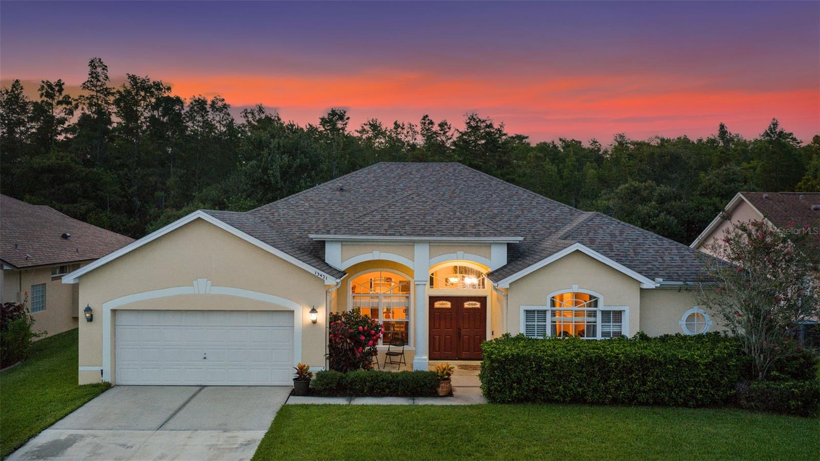 **MOVE IN READY** POOL HOME** Versatile 5th Bedroom** NO REAR NEIGHBORS** ONE STORY HOME** Welcome to 13471 Falcon Pointe Drive, a beautifully maintained 5 bedroom, 3-bathroom single story pool home located in the highly desirable Hunter’s Creek community of Orlando. Set on a quiet street with no rear neighbors and peaceful wooded conservation views, this spacious residence offers over 2,700 square feet of thoughtfully designed living space perfect for both everyday comfort and entertaining. With its lush landscaping, well-manicured lawn, and inviting double-door entry, the curb appeal is truly exceptional.
Inside, you’ll find an open and airy split floor plan enhanced by soaring ceilings, natural light, and custom built-in shelving. Formal living and dining areas provide elegant gathering spaces, while the expansive family room, complete with a custom-built entertainment center, offers the perfect place to relax. A separate den offers ideal flexibility as a home office, media room, or fifth bedroom, easily adapting to your lifestyle needs.
The gourmet kitchen is a standout feature, boasting 42” solid wood cabinetry, granite countertops, stainless steel appliances, a glass tile backsplash, a built-in wine rack and glass holder, and a separate dry bar or coffee station. Adjacent to the kitchen is a cozy breakfast nook with a corner window overlooking the screened-in pool and lanai, offering a peaceful view to start your day.
The private primary suite offers a true retreat, complete with its own solarium sitting area that looks out onto the pool and greenery beyond—perfect as a quiet reading nook or private office space. The en-suite bath is designed for comfort and luxury with a deep soaking tub, a walk-in shower, dual vanities, granite countertops, and ample cabinetry.
The three additional bedrooms are spacious and well-located, with two of them sharing a beautifully updated Jack and Jill bathroom that includes dual sinks and stylish finishes. The third full bathroom functions as a dedicated pool bath, offering direct access from the lanai for added convenience.
Step outside to a true Florida oasis. The fully screened-in lanai features paver decking, a covered patio with ceiling fans, and a sparkling pool perfect for cooling off or entertaining guests. With mature landscaping and a private wooded backdrop, the backyard offers a rare combination of beauty and privacy.
Located in the quiet Falcon Pointe neighborhood within the master-planned community of Hunter’s Creek, residents enjoy access to top-rated schools, nature trails, neighborhood parks, and amenities like tennis and basketball courts. The home also offers quick access to major highways, shopping, dining, and world-class attractions, making it a prime location for convenience and quality of life.
With its flexible layout, upscale finishes, and unbeatable location, this move-in-ready home is the complete package. Schedule your private tour today and discover why 13471 Falcon Pointe Drive is the perfect place to call home.