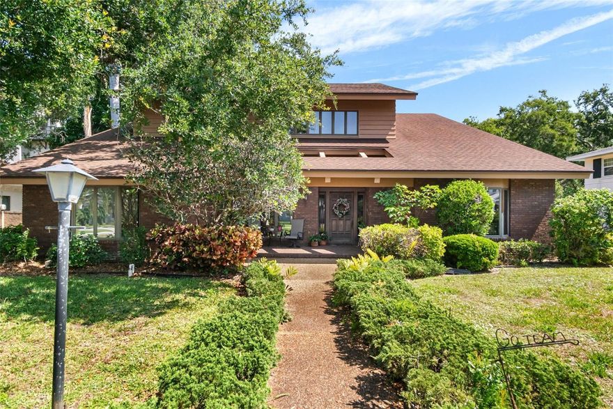 Nestled on one of Sarasota's most sought-after streets, this classic brick residence on South Drive presents a rare opportunity to own a truly special property in the heart of Cherokee Park. Lovingly maintained by its original owner, the home rests on an exceptional, oversized lot - enhanced by deeded access from South Lodge Drive, adding a unique level of privacy and convenience. The timeless two-story design features generously scaled living spaces that exude warmth and charm. The main floor offers three well-appointed bedrooms, two and a half bathrooms, formal living and dining rooms, and a welcoming family room that flows seamlessly into the kitchen. A cozy den/library with custom built-ins provides a peaceful retreat for work or relaxation. The upper level is dedicated to the expansive primary suite, complete with two full bathrooms and abundant space to fret your ideal sanctuary. Outdoors, a canopy of mature trees and lush landscaping surround the pool and deck - perfect for entertaining. Located outside of the flood zone and just minutes from Siesta Key Beach, Southside Village, and Downtown Sarasota, this property offers endless potential to renovate, expand, or build new in one of the city's most desirable neighborhoods.