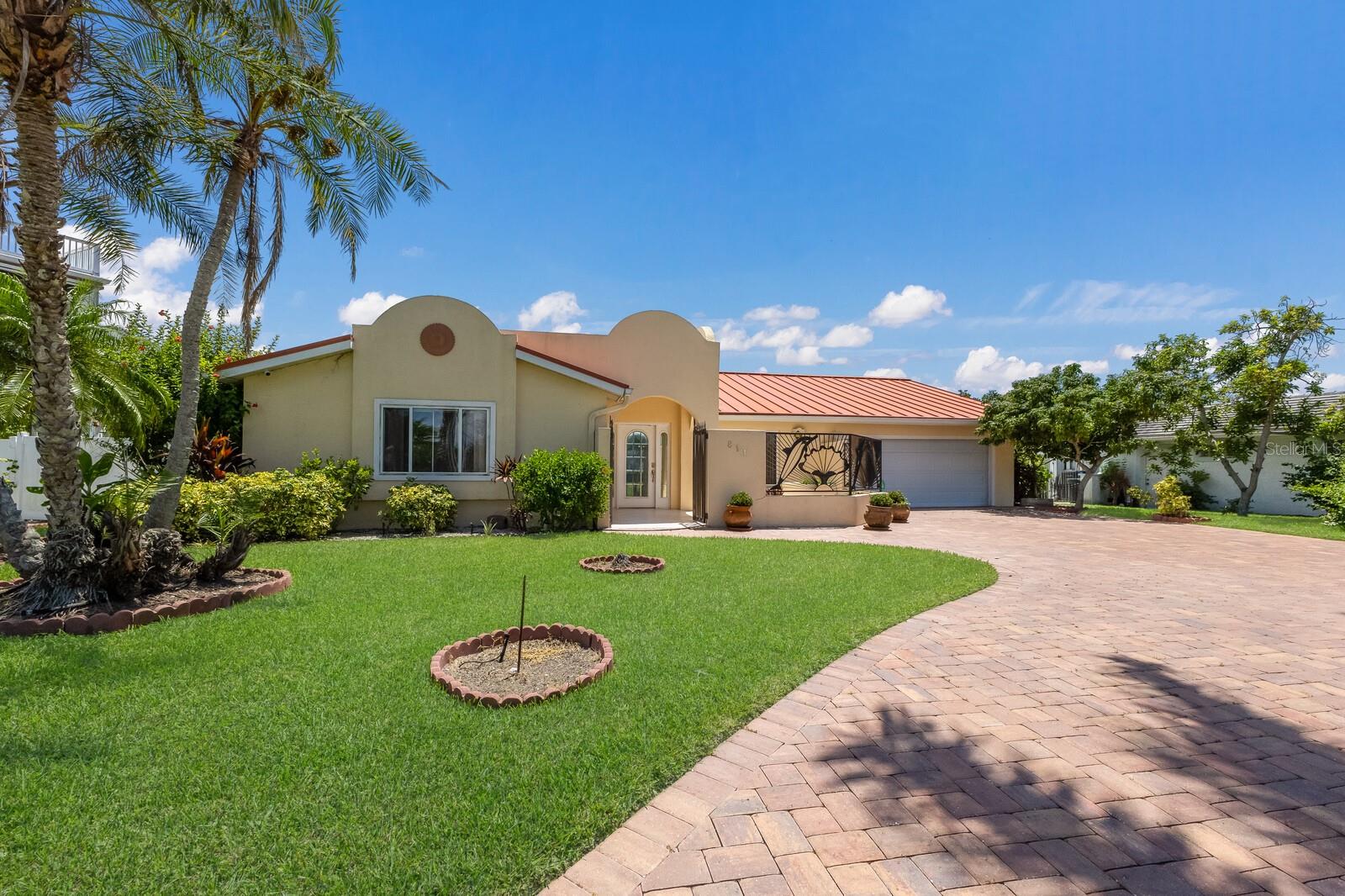 DIRECT BAYFRONT POOL HOME IN BAY COLONY ON TERRA CEIA BAY! Don’t miss this rare opportunity to own an exceptional waterfront property in one of the area’s premier locations. With deep water access and no bridges to Terra Ceia Bay, Tampa Bay, and the Gulf of Mexico, this home is perfect for boating, fishing, and enjoying Florida’s coastal lifestyle to the fullest. This beautifully maintained single-story, 3-bedroom, 3-bathroom home showcases a charming Mediterranean-inspired exterior, complete with lush tropical landscaping, a paver driveway, and a gated courtyard entry. The elevated property has never experienced flooding from storms, and the standing seam metal roof complements its distinctive architecture. Step inside to an expansive open-concept living area featuring neutral tile flooring throughout—ideal for both everyday living and entertaining. Large windows and sliding glass doors fill the home with natural light and offer breathtaking panoramic water views. The spacious kitchen includes wood cabinetry, stainless steel appliances, and abundant counter space, along with a large wraparound bar for casual seating. Bedrooms are on the other side of the home and two of them, including the primary suite, feature en suite bathrooms. The third bedroom offers French doors and built-in shelving, making it an excellent option for a home office. Additional features include a large indoor laundry room with cabinetry and a utility sink, plus a 2-car garage. Outside, the recessed sliding glass doors lead to your private screened patio, sparkling pool, and fully fenced backyard. The pavered pool deck provides multiple covered seating areas, perfect for gatherings with friends and family. Enjoy days fishing from your dock, or take the boat to nearby restaurants and barrier islands. With no HOA (voluntary membership), this property would also make a fantastic short-term rental. Located just minutes from I-275 and I-75, you’ll have easy access to downtown St. Pete, Tampa International Airport, and the white-sand beaches of Anna Maria Island. This is more than a home—it’s a lifestyle. Schedule your showing today!