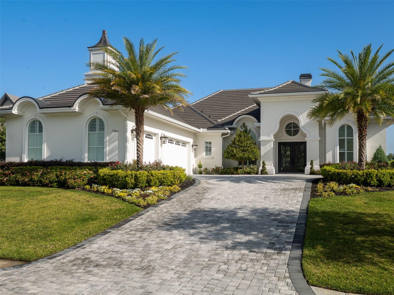 Located in Brittany Estates within Golden Ocala Golf and Equestrian Club, this exceptional property offers luxurious living just minutes from the renowned World Equestrian Center—with convenient golf cart access to its world-class amenities. Situated on a beautifully manicured lot, this home boasts panoramic views of the Muirfield tribute hole on Golden Ocala’s championship course. Inside, you'll find 4 spacious bedrooms, 4 full bathrooms, and an office complete with a kitchenette—perfect for working from home or accommodating guests. High tray ceilings add a grand sense of space, while walk-in, built-in closets provide thoughtful storage throughout. The home features elegant porcelain tile flooring throughout, and the gourmet kitchen is a chef’s dream, with a large center island, wine cooler, and abundant cabinet and counter space. A stunning porcelain tile fireplace serves as a focal point in the main living area while sliding doors open to a screened-in patio overlooking a resort-style pool and spa, perfect for both relaxing and entertaining. An outdoor kitchen enhances the space, and a portion of the backyard is fenced, ideal for pets. This exquisite property offers the perfect blend of sophistication, comfort, and convenience in one of Florida’s most desirable equestrian and golf communities.
