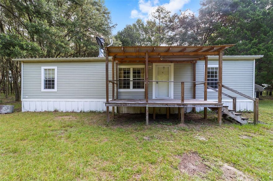 Country Living with Modern Convenience! Discover peaceful country living on this beautiful 10-acre property in Newberry, featuring a 2011-built 3-bedroom, 2-bath double-wide manufactured home with a new roof (2024). Tucked away down a quaint dirt road with very few neighbors, this property offers privacy, space, and tranquility while still being just 7 miles from Publix and the heart of Newberry. Enjoy the best of both worlds — 5 acres planted with pine trees and an agricultural exemption already in place, making it ideal for anyone seeking a homestead, hobby farm, or simply extra room to roam. The home features a functional layout with an open living area, spacious kitchen, and comfortable bedrooms, perfect for relaxed country living. If you’ve been searching for peace, privacy, and modern convenience, this is your perfect match — country living just minutes from town!