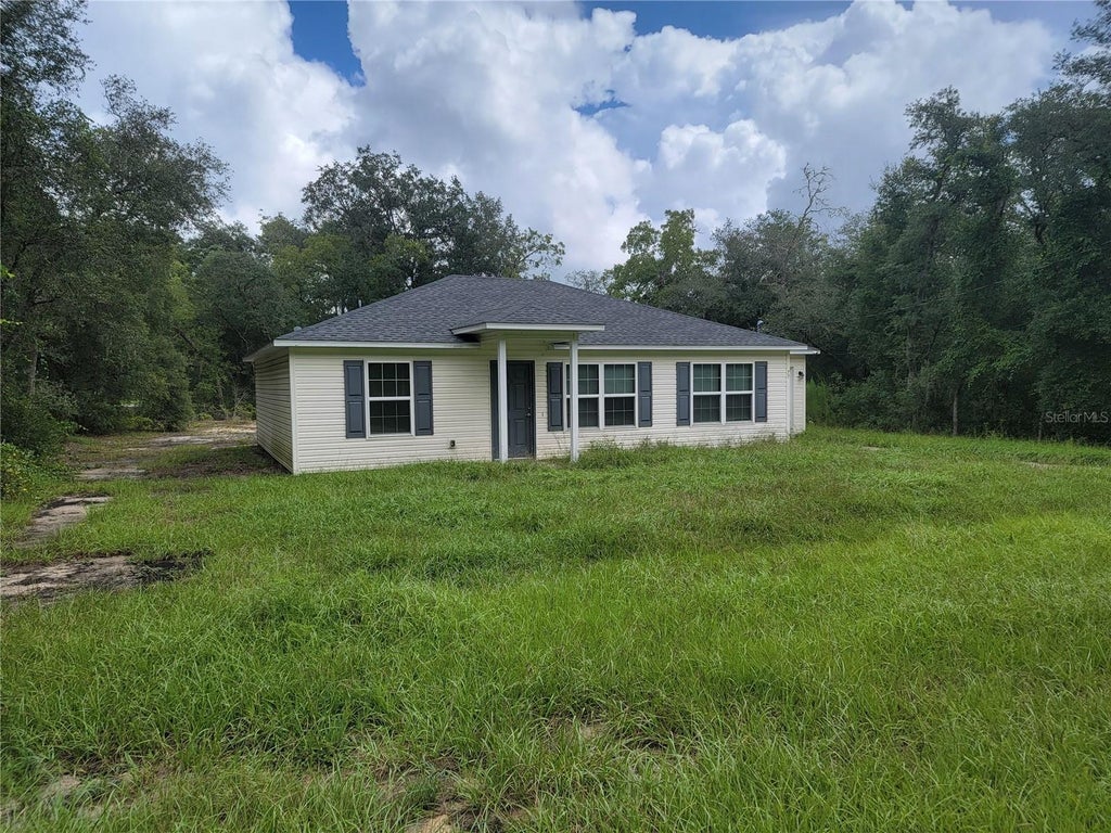 Photo of 77 Fisher Way Course, Ocklawaha, FL 32179 (MLS # OM731612)