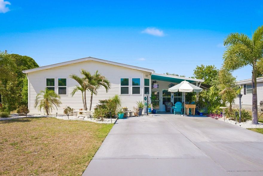 If you’ve been waiting for something in Lake Tarpon Village that doesn’t feel like every other home in the neighborhood, this is it.  Fully renovated. You own the land. Located in an X flood zone. And finished in a way that stands out the second you walk through the door.  Vaulted ceilings and all new windows bring in natural light from every angle, highlighting wide plank luxury flooring and a layout that feels open, clean, and intentional, not pieced together like so many others.  The kitchen is where this home separates itself. Quartz countertops, stainless steel appliances, a propane gas range that is hard to find here, sleek cabinetry, and bar seating that naturally becomes the gathering spot when friends and family come over.  The primary suite doesn’t try to impress, it just does. Dual sinks and a fully reimagined walk in shower with black framed glass, rainfall head, body jets, handheld wand, and custom tile work that feels more like a boutique hotel than a manufactured home.  And then there’s the Florida room, the space everyone ends up wanting. Fully finished, flexible, and perfect for everything from quiet mornings to hosting without feeling cramped.  You’ll also find an oversized laundry room, dedicated golf cart garage or storage space, and an irrigation system already in place. The upgrades here were done right.  But let’s be honest, you’re not just buying the home.  Lake Tarpon Village offers a newly renovated heated pool, clubhouse, and an active social scene with shuffleboard, bocce, and a golf club that keeps the community connected.  And what most buyers overlook until it’s too late is the freshwater access to Lake Tarpon. Boating, fishing, sunset cruises, it’s all right here, along with a community ramp and space for your RV or boat.  Bottom line, you can buy a home in this community, or you can buy one that’s already done right.  All of this just minutes from shopping, dining, and the Gulf Coast beaches.