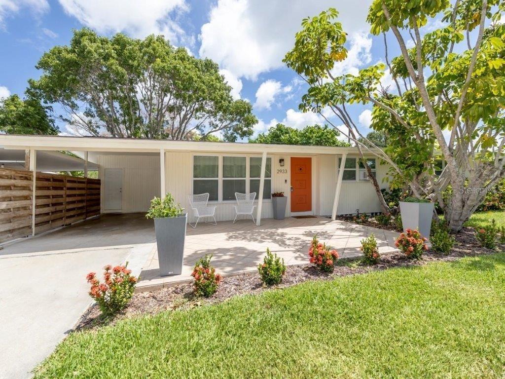 Nestled in one of Sarasota's most sought-after neighborhoods, this recently remodeled midcentury modern home is offered unfurnished or turn-key giving you the option to move right in or to use as your next investment property with a proven rental history of over 30 5-star reviews. Extensive updates throughout the home include a BRAND NEW RHEEM HVAC (2025), a NEWER ROOF (2022), new drain lines/plumbing (2022/2025) and major updates to the kitchen, bathrooms, and bedrooms (2022). Featuring three bedrooms and two full bathrooms, the home showcases vaulted ceilings and transom windows, infusing the space with natural light. The thoughtfully designed layout includes an open-concept living and dining area adjacent to the kitchen, perfect for entertaining. A custom built-in bookcase in the living room doubles as a hidden doorway to one of the bedrooms - ideal for use as a guest room, home office or extended living area. French doors off of the kitchen lead to a spacious and private fenced in backyard with room to create your own private oasis. Additional features include an oversized carport and shed complete with electricity - perfect for storage, hobbies, or a workshop. Located on a quiet street within city limits, you'll enjoy quick access to downtown Sarasota, Paver Park, Southside Village, Sarasota Memorial Hospital, and the famous Siesta Key Beach. The nearby Legacy Trail is just a bike ride away, offering a perfect blend of urban convenience and outdoor adventure. Whether you're looking for your dream home or a high-performing investment property, this is a rare opportunity to own a piece of paradise.