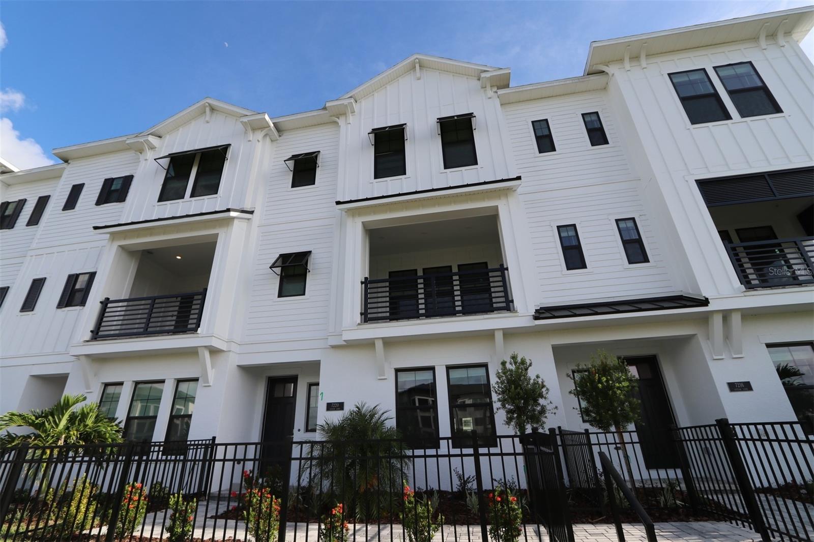 Luxury Living Meets Low-Maintenance in this 3-Story David Weekley Townhome. Step into the Rainwater floor plan, with a refined coastal living with this beautifully designed three-story townhome by David Weekley Homes, perfectly situated just half a mile from Waterside Place's vibrant shopping and dining. With preserve and water views from your private balcony, this home blends serene surroundings with luxury finishes and walkable convenience. On the first floor, you'll find a spacious two-car garage and a private study, ideal for guests or a home office. The heart of the home lies on the second floor, featuring a gourmet kitchen with KitchenAid appliances, wine cooler, and refrigerator included, flowing seamlessly into the open-concept dining and family rooms. Enjoy stunning views from the balcony and the convenience of a powder bath on this level. Laminate flooring runs throughout the main living areas, with tile in the powder and laundry rooms for added durability. Retreat to the third floor, where the owner’s suite boasts his and her walk-in closets, shower, and a free standing tub. A second bedroom with an en-suite bath, and a laundry room with folding counter complete the upper level—functionality meets comfort at every turn. Enjoy peace of mind with hurricane impact windows, Zone X flood rating, and the perks of living in a low-maintenance, gas community where the HOA covers landscaping, irrigation, exterior upkeep, and roof maintenance. Resort-style amenities include: Clubhouse, resort pool, pickleball court, fire pit, kayak and canoe racks from private dock, dog park, butterfly garden, and a water taxi to and from the Sunday Farmers Market. Call us for a tour!