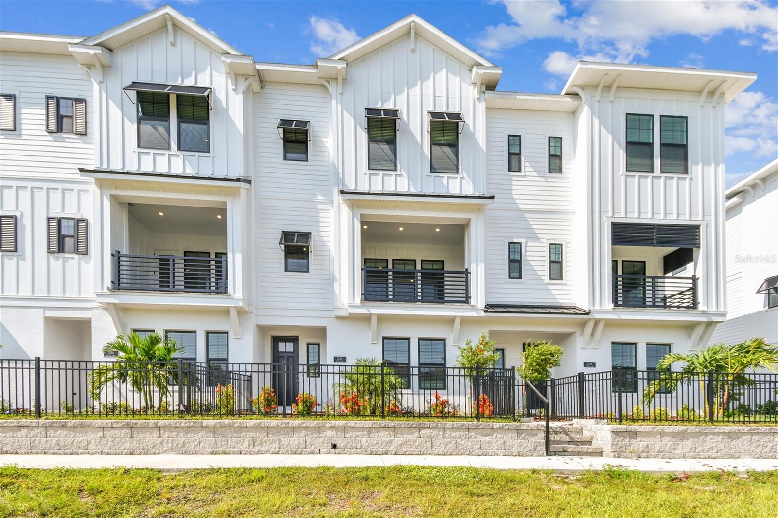 One or more photo(s) has been virtually staged. Luxury Living Meets Low-Maintenance in this 3-Story David Weekley Townhome. Step into the Rainwater floor plan, with a refined coastal living with this beautifully designed three-story townhome by David Weekley Homes, perfectly situated just half a mile from Waterside Place's vibrant shopping and dining. With preserve and water views from your private balcony, this home blends serene surroundings with luxury finishes and walkable convenience. On the first floor, you'll find a spacious two-car garage and a private study, ideal for guests or a home office. The heart of the home lies on the second floor, featuring a gourmet kitchen with KitchenAid appliances, wine cooler, and refrigerator included, flowing seamlessly into the open-concept dining and family rooms. Enjoy stunning views from the balcony and the convenience of a powder bath on this level. Laminate flooring runs throughout the main living areas, with tile in the powder and laundry rooms for added durability. Retreat to the third floor, where the owner’s suite boasts his and her walk-in closets, shower, and a free standing tub. A second bedroom with an en-suite bath, and a laundry room with folding counter complete the upper level—functionality meets comfort at every turn. Enjoy peace of mind with hurricane impact windows, Zone X flood rating, and the perks of living in a low-maintenance, gas community where the HOA covers landscaping, irrigation, exterior upkeep, and roof maintenance. Resort-style amenities include: Clubhouse, resort pool, pickleball court, fire pit, kayak and canoe racks from private dock, dog park, butterfly garden, and a water taxi to and from the Sunday Farmers Market. Call us for a tour!