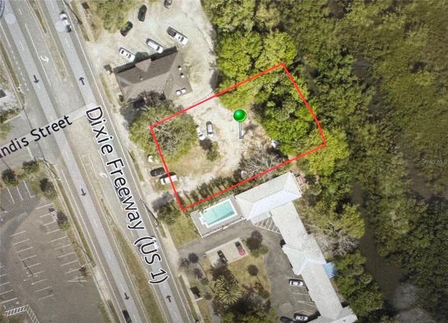 US 1 frontage.  Zoned Commercial, with city approval, can be used for surface parking, short-term rentals, and retail.
Property backs up to canal that can lead to the intracoastal. Buyer must verify.