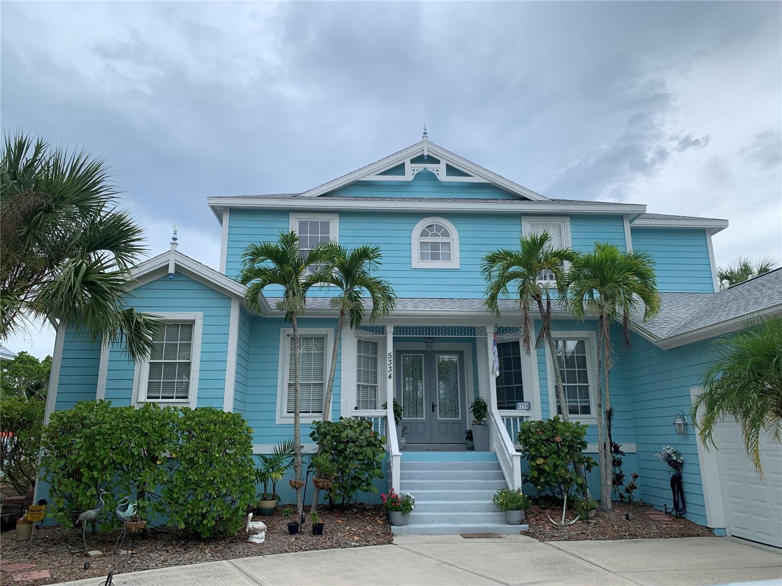 Beautiful home that was rebuilt in 1997 located on Palm Island on Siesta Key. Palm Island is considered the “heart of Siesta Key”. When the home was rebuilt it was raised 10 feet above ground. This home is a short walk to Siesta Beach, which has been named the #1 Beach in the USA numerous times. It is also just minutes from the Village that has restaurants, shopping, etc. You would have access to and from the mainland by two bridges located on the north side and south side of Siesta Key. Bicycles are a good mode of transportation as well as the free trolleys that run the entire island and downtown. The home is a true paradise which includes 4 bedrooms, 3 full bathrooms and a two car garage. Enjoy the vaulted ceiling and 20 foot ceiling upon entry. There is a relaxing heated pool that is screened to enjoy the sunshine. Just imagine a lazy day at the beach followed by a dip in the pool, with no worries. What more could you ask for? The large kitchen offers plenty of space for cooking and entertaining as well as a walk in pantry. It has a large island with seating so everyone can be around and share. Plenty of seating at the dining room table for 6. The laundry room has a washer and dryer along with a sink and area to hang clothes above the sink. The primary bedroom has two twin beds that can be put together and make a king bed and 2 walk in closets. The other three bedrooms have a queen bed, full bed and a twin bed. The bathrooms are all good size. There is also a game room upstairs where you can do crossword puzzles or play bridge. A three zone A/C system operates the home. This home can be rented for season or off season. Please call for off season rates and multiple months discount. No Smoking in the home or on the grounds. The fireplace in the family room may not be used.