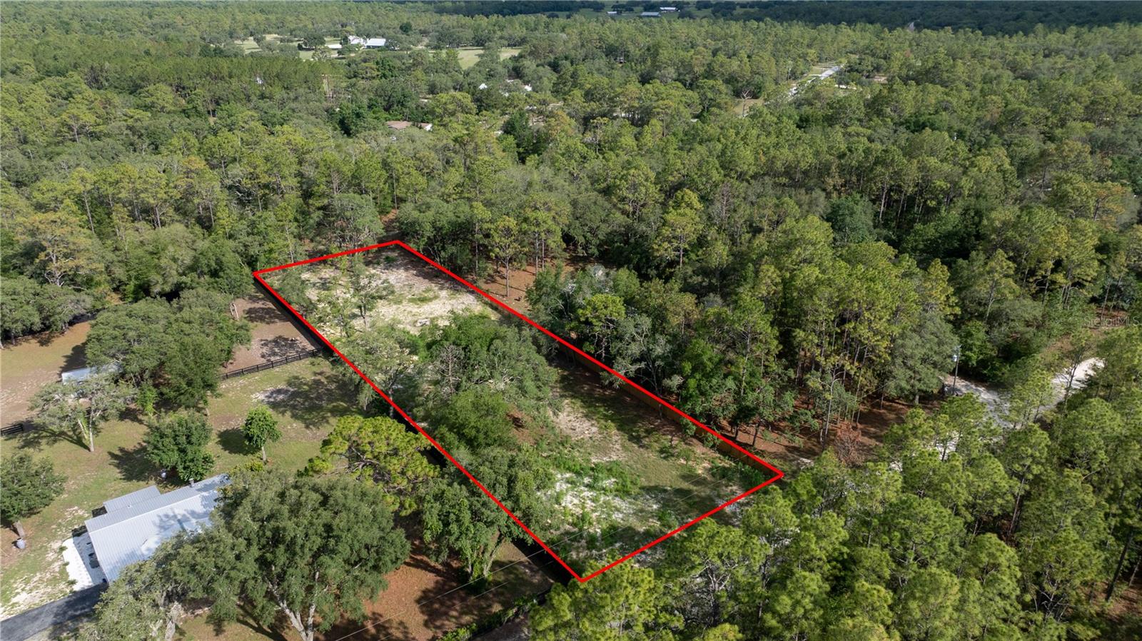 Discover the perfect blend of peace, space, and opportunity with this fully fenced and cleared 0.85-acre lot in the heart of Dunnellon, FL. Zoned A1, this versatile property allows for mobile, modular, or site-built homes and offers the freedom to create a homestead, raise animals, or grow your own garden—all with no HOA restrictions. Located on a quiet dirt and gravel road, the lot sits high and dry, providing a private rural feel while still being just minutes from local shopping, dining, and the natural beauty of Rainbow Springs. With plenty of usable space and immediate access, this property is ready for your vision. Buyer and buyer’s agent to verify all zoning, building restrictions, and utility availability directly with Marion County. Seller and listing agent make no guarantees; do your due diligence to ensure the property meets your intended use.