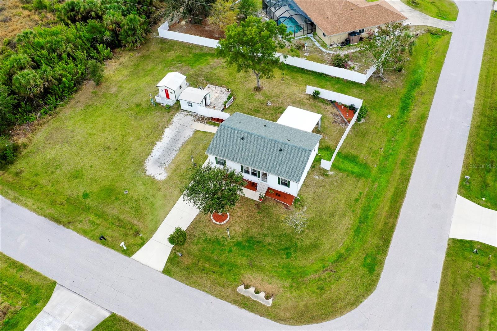 Move-In Ready 3-Bedroom Modular Home on Double Corner Lot in Southwest Florida – Ideal Snowbird Retreat or Starter Home!
Welcome to your Florida dream home! This well-maintained 3-bedroom, 2-bathroom modular home was built in 2005 on a permanent foundation and is located on a spacious double corner lot in a quiet, established neighborhood—perfect for seasonal residents or full-time living.
With a new roof and A/C (2021), and energy-efficient newer windows, this home is designed for low maintenance and built to withstand winds up to 150 mph—ideal for Florida’s coastal weather conditions.
Step inside to a bright, open-concept living space with vaulted ceilings and a split floor plan that offers privacy for guests or family. The open kitchen with dining area and large living room are perfect for entertaining or relaxing after a day at the beach.
Enjoy the Florida lifestyle on your rear deck, or take advantage of the wheelchair-accessible ramp on the side. Need a workshop, craft space, or home office? This property features two separate workshops, one with air conditioning, perfect for your hobbies or storage needs.
The yard adds privacy and is great for pets. Best of all, this home is not in a flood zone and is situated on high elevation, giving you extra peace of mind.
Located just minutes from Port Charlotte, North Port, Englewood, Venice, and Wellen Park, you’re close to top-rated hospitals, shopping centers, local dining, entertainment, and some of the best Gulf Coast beaches—all within a 5 to 10-minute drive.
Whether you're looking for a seasonal snowbird home, a low-maintenance Florida retirement home, or a starter home near the beach, this property checks all the boxes.
Most furniture can be included—just bring your toothbrush and move in!
Call today for more information or to schedule your private showing!