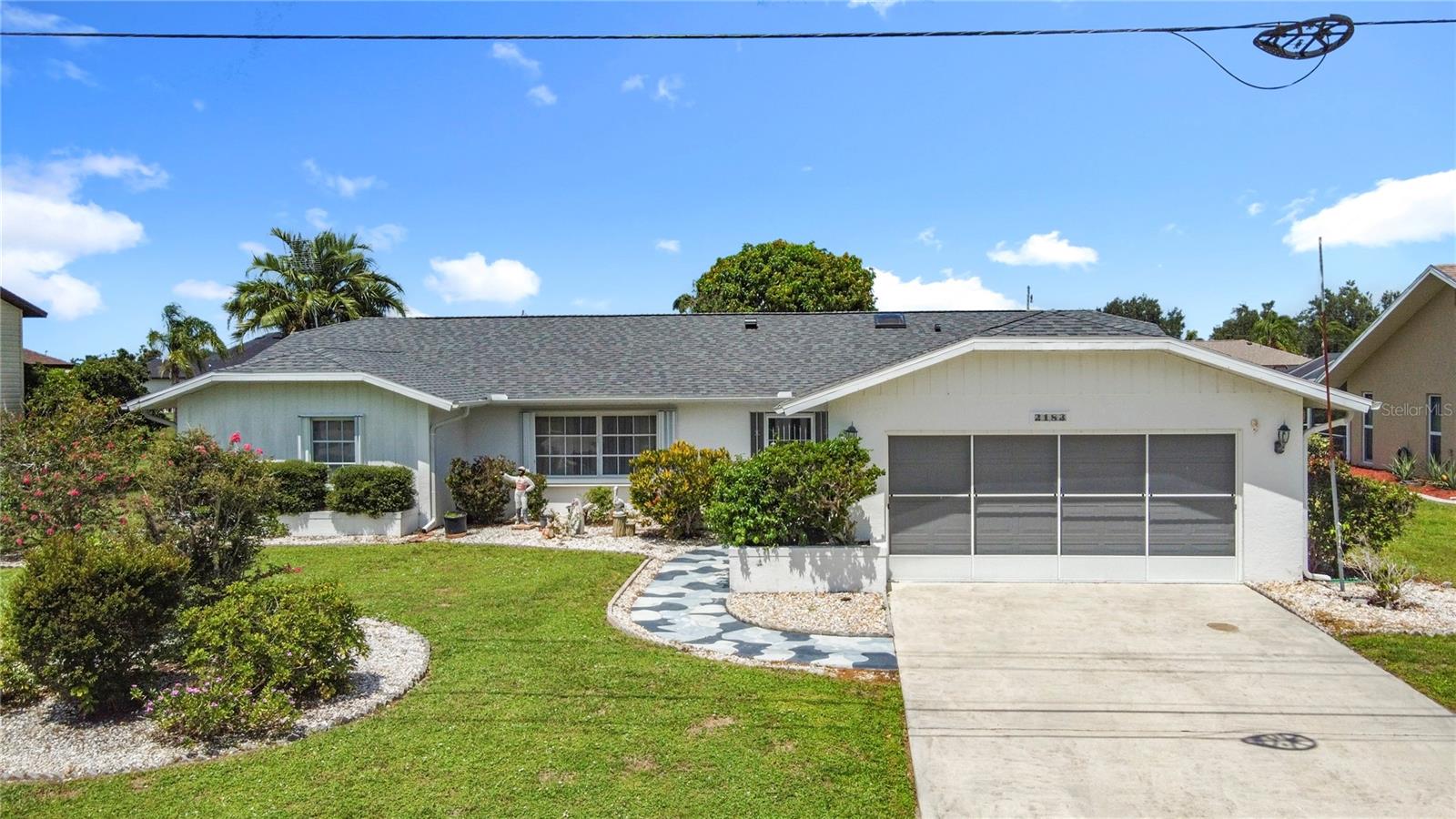 This residence presents a fantastic opportunity for a first-time homebuyer or an investor looking for a project. With a little bit of TLC, this home has the potential to become a true gem. The interior features a functional split-bedroom layout, providing privacy and comfort. The living area is spacious and bright, and a closed-in lanai offers a perfect space for relaxation or entertaining. The kitchen features ample cabinetry, and there's a separate dining area for meals. You'll also find lovely mango trees in the backyard, a delightful bonus for any gardener or fruit lover. Nestled in a quiet and friendly neighborhood, this property offers a serene living environment away from the hustle and bustle. The community is known for its peaceful atmosphere, making it a perfect place to relax and unwind. Enjoy a short drive to numerous local attractions, including beautiful parks, diverse restaurants, and unique shops. The area provides plenty of recreational opportunities, from boating and fishing on the nearby waterways to exploring the scenic trails.