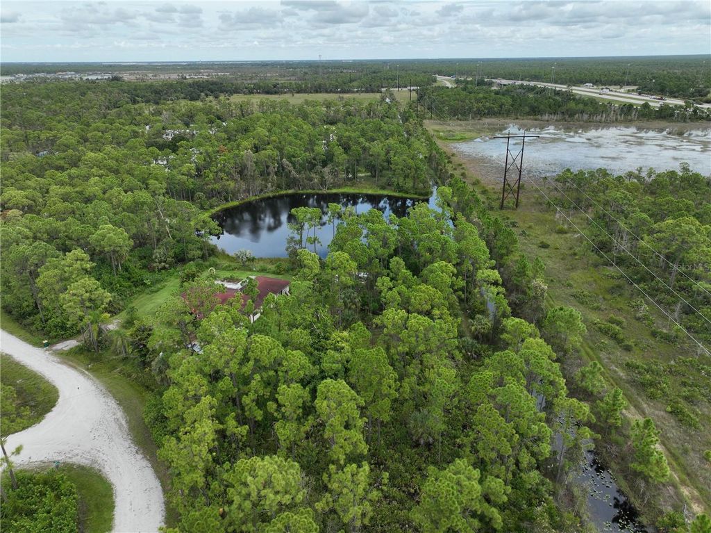 Photo of 12422 Caravan Drive, Punta Gorda, FL 33955 (MLS # O6341964)
