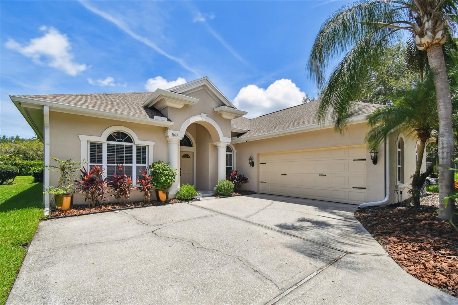 Welcome to the sought-after NORTHFIELD, one of the Wonderful Communities of LANSBROOK. Enjoy Florida living surrounded by parks, hiking trails, spring-fed Lake Tarpon, and thousands of acres of preserved forest and watersheds. Lansbrook is simply an ideal place to live, regardless of your life stage. This pool house offers 2,462 sq ft of smart space for the entire family, featuring 3 bedrooms, a flex/office room (with built-in wardrobe - easily used as 4th bedroom), 2 bathrooms inside, and 1 half bathroom outside by the pool. Live comfortably with a 10-foot ceiling throughout, a formal living room, and a dedicated dining room connected to the massive kitchen, highlighting Jenn-Air cooking appliances and plenty of storage. An oversized three-panel sliding door retracts, allowing you to extend those memorable gatherings either indoors or out. The house sits on a corner lot on almost 1/3 of an acre, conveniently located where you could walk to East Lake High School and the application-only East Lake Middle School Academy of Engineering (a STEM learning prep school). You might be pleased to know about recent major investments in the house. NEW A/C 2021, NEW ROOF Sep 2023 (including hurricane brackets above building code), FULL POOL RENOVATION (including resurfacing, new deck & lanai pavers, ALL new equipment, saltwater conversion, and gas water heater conversion), FULL HOUSE water softener (including a reverse osmosis filtration system in the kitchen sink). Experience park-like living, yet close to everything. A short drive takes you to a wide variety of options for shopping, restaurants, medical facilities, churches, state parks, and award-winning beaches. Schedule your private showing today. See for yourself the house you might soon call HOME.