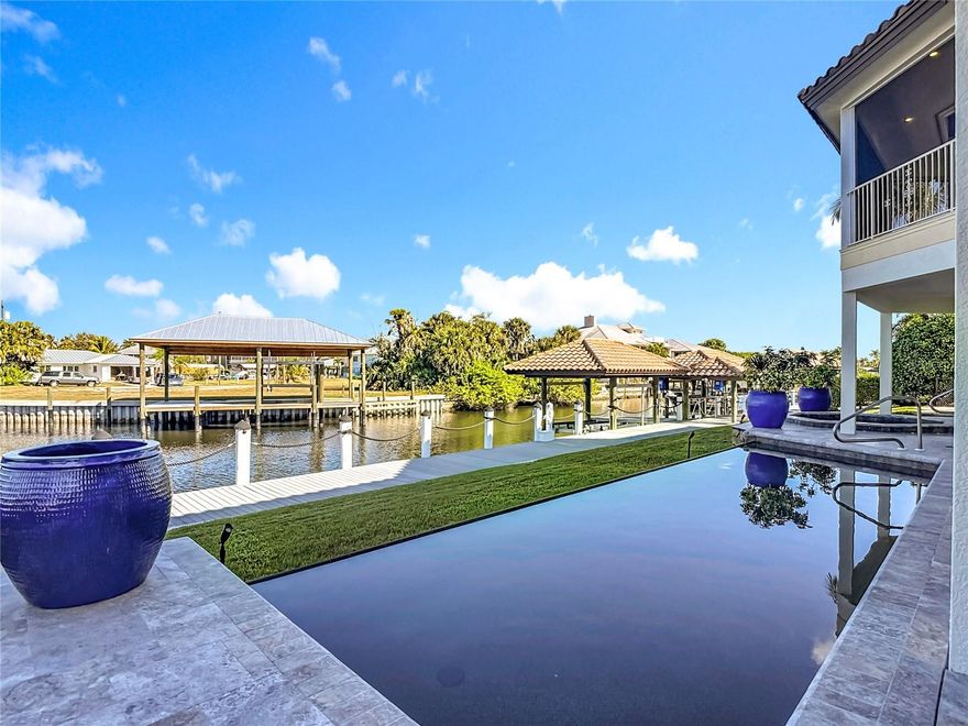 Gulf-Access Waterfront Home | No Bridges | Deep-Water Dock | Punta Gorda, FL
Experience the ultimate Punta Gorda waterfront lifestyle at 24248 Treasure Island Blvd, a rare deep-water, no-bridge Gulf-access luxury home designed for boating, safety, and year-round Florida living. Built with solid concrete block construction, this residence offers over 4,000 square feet of living space, hurricane-resistant features, and an industrial-grade whole-home generator, making it an ideal choice for relocation buyers, second-home owners, and boating enthusiasts seeking peace of mind and fast water access.
Inside, the home features bright open living areas, elegant hardwood floors, and a gourmet chef’s kitchen with solid wood cabinetry, gas cooking, double ovens, walk-in pantry, wine cooler, and a spacious dining area ideal for entertaining. The primary suite offers two walk-in closets, private climate control, a spa-inspired bathroom, and direct access to a full-length screened porch with water views.
Designed for multi-generational living or extended guests, the home includes a private first-floor guest or mother-in-law suite with its own entrance, full bath, kitchenette, and hurricane-impact sliders, plus an additional second-floor guest suite with waterfront views.
Outdoor & Boating Features:
Outdoor living is exceptional, featuring a heated pool and spa, brand-new travertine deck (2024), breezeway access, and a full-width screened porch spanning the entire back of the home. Boaters will appreciate the deep-water canal with NO bridges, providing fast access to Charlotte Harbor and the Gulf of Mexico.
The property includes approximately 100 feet of private dockage with 30/50 AMP power, water, lighting, security cameras, a 62-foot free-span deck for larger vessels, boat house with lift, jet ski bunks, kayak launch, and a climate-controlled tackle and equipment room with custom storage.
Additional features include a fully serviced elevator (2025), oversized 40’ x 33’ garage, central vacuum system, updated alarm systems (2024), multiple storage areas, and meticulously maintained mechanical systems. The home also offers approximately 700 square feet of non-conforming first-level space, ideal for a home office, recreation area, or extended-stay guests (buyer to verify square footage and permitted use).
Homes offering this rare combination of hurricane-resistant construction, deep-water Gulf access, no bridges, luxury features, and move-in readiness are extremely limited in Punta Gorda.
Additional Opportunity:
The adjacent waterfront lot (80’ x 120’) with approximately 92 feet of dockage and two boat lifts is also available for purchase—perfect for expanding your waterfront estate or securing additional vessel capacity.
?? Schedule your private showing today and discover one of the best Gulf-access waterfront opportunities in Punta Gorda, Florida.