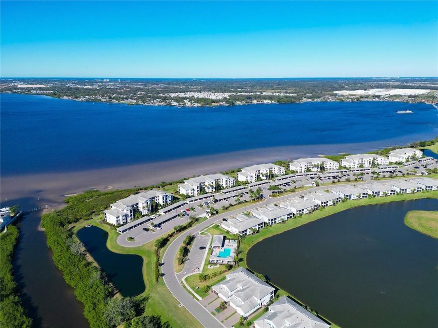 Stunning Birkdale model condo available now. BOATERS WELCOME!! Overlooking the majestic Manatee river, this beautifully appointed 2 bedroom, 2 bathroom condo is located on the 3rd floor(elevator) and is ready for new owners! Situated in the 24/7 Guard Gated Community of Tidewater Preserve, this well-maintained condo offers tile on the diagonal throughout the entire condo with zero carpet. You will be impressed with all the upgrades, which include an entire wall featuring shiplap with a chevron pattern, crown molding, and designer unique lighting throughout the house. The kitchen offers 42" Shaker cabinets, quartz counters, stylish backsplash, pendant lighting, and a spacious quartz island with shiplap on the side, with eat in bar area(stools included). Enjoy your Sunset Sanctuary by Relaxing on your screened lanai with stunning full river views where you take in year-round sunsets—and keep an eye out for dolphins and manatees! The 2 bedrooms are situated down the hallway from the main living/ kitchen. The primary bedroom fits a king size bed easily, walk in custom closet with built ins, linen closet with shelves, the ensuite bathroom features a large walk in shower, and quartz countertops. The secondary bedroom is available for guests and is currently being used as a home office. The laundry room supports a full size washer and dryer and has space for additional storage. This condo also offers an additional storage closet located just outside of the front door opposite the stairs and an assigned carport. The community of Tidewater Preserve offers a clubhouse, community Pool w/ lap lanes, a pergola covers the area with a gas grill and Fireplace for outdoor entertaining. Additionally, there are har tru Tennis Courts, dog park, walking trails, and a playground. The Community also offers a Boat Marina with a Max Boat Size: 32 FT. Slips for rent only and paid annually. There is a lock system to get boats to/from Manatee River. There is a Boat Ramp within the Community. Canoe and Kayak enthusiasts, racks available for rent and a private launch. This community has 2 fitness centers, and 2 additional satellite pools. Close to Lakewood Ranch, beaches, restaurants, UTC mall, Costco Plaza, and golfing! Call today for a private showing.