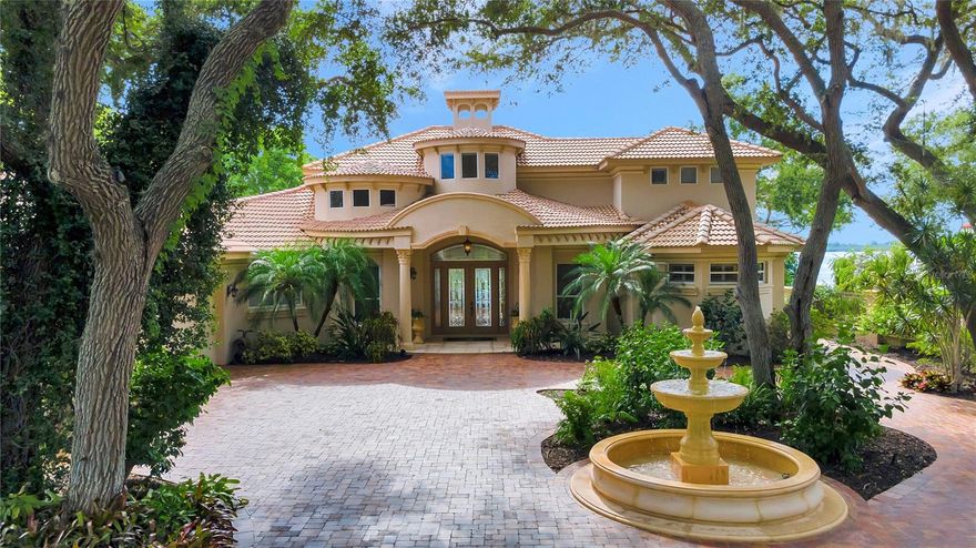 Don’t miss your once-in-a-lifetime chance to own this stunning 1.2 acre waterfront estate on Palma Sola Bay. This magnificent Neo-Mediterranean home is secured by a lavishly landscaped custom wall with wrought gates and distinct hand-forged lighting. With 4 bedrooms and 4 ½ baths, this luxurious estate is perfect for entertaining. The great room and dining room feature disappearing sliding glass doors for unobstructed sunset water views. The gourmet kitchen is a chef's delight with premium, fully integrated appliances including Wolf gas range, Sub Zero built-in refrigerator, Miele microwave, oven, & dishwasher. The custom-built wine cellar features a 20 ft high circular ceiling and ample Sub-Zero temperature-controlled storage making it ideal for any wine enthusiast. The pool and lanai areas overlook beautiful Palma Sola Bay and the one-of-a-kind waterfall and lagoon designed and installed by Lucas Congdon of Lucas Lagoons/Insane Pools. Boaters will love the 40,000-pound boat lift along with the double jetski/kayak lift. Located a short paddle away from Robinson Preserve and 4 miles from the world-famous beaches of Anna Maria Island. There are truly too many wonderful amenities to detail, please contact the listing agent or visit the listing website for a full list of features.