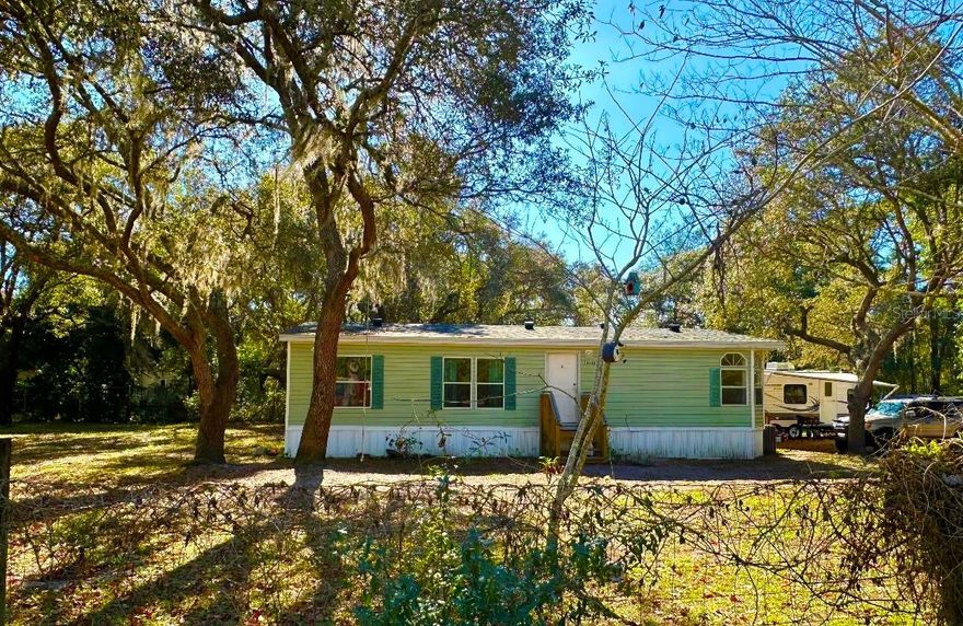 Your Private Sanctuary Awaits!

Nestled on 0.52 acres of cleared, fully fenced land and surrounded by tranquil woods, this beautifully updated 3-bedroom, 2-bathroom home offers the perfect balance of privacy and convenience. Located in a quiet neighborhood, you'll enjoy a peaceful setting while being just minutes from local shops and close to the river for outdoor recreation. Step inside to a Brand-new flooring throughout, creating a bright, modern, move-in-ready atmosphere. The open concept living and dining areas are filled with natural light, making them ideal for both everyday living and entertaining. The primary suite is a true retreat, featuring an en-suite bathroom with a large jacuzzi tub, perfect for relaxing after a long day. Two additional bedrooms provide flexible space for guests, family, or a home office. Major updates completed in 2024 include a brand-new roof, new water heater, and a new motor for the AC unit, offering peace of mind and long-term value. The kitchen is practical and functional, with newer appliances, ample storage and workspace, and all appliances convey with the home. A small metal shed is also included for extra storage. Outside, enjoy the fully fenced yard, ideal for pets, gardening, entertaining, or simply relaxing in your own private oasis. The property features mature trees and natural landscaping, including a lime tree, blueberry bush, thornless blackberry bush, magnolia tree, and more. This home is a rare find offering space, privacy, modern updates, and natural beauty. Schedule your showing today!