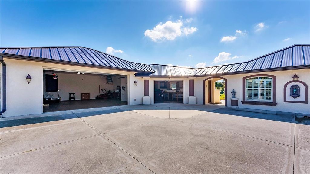 Photo of 646 Boundary Boulevard, Rotonda West, FL 33947 (MLS # D6144742)