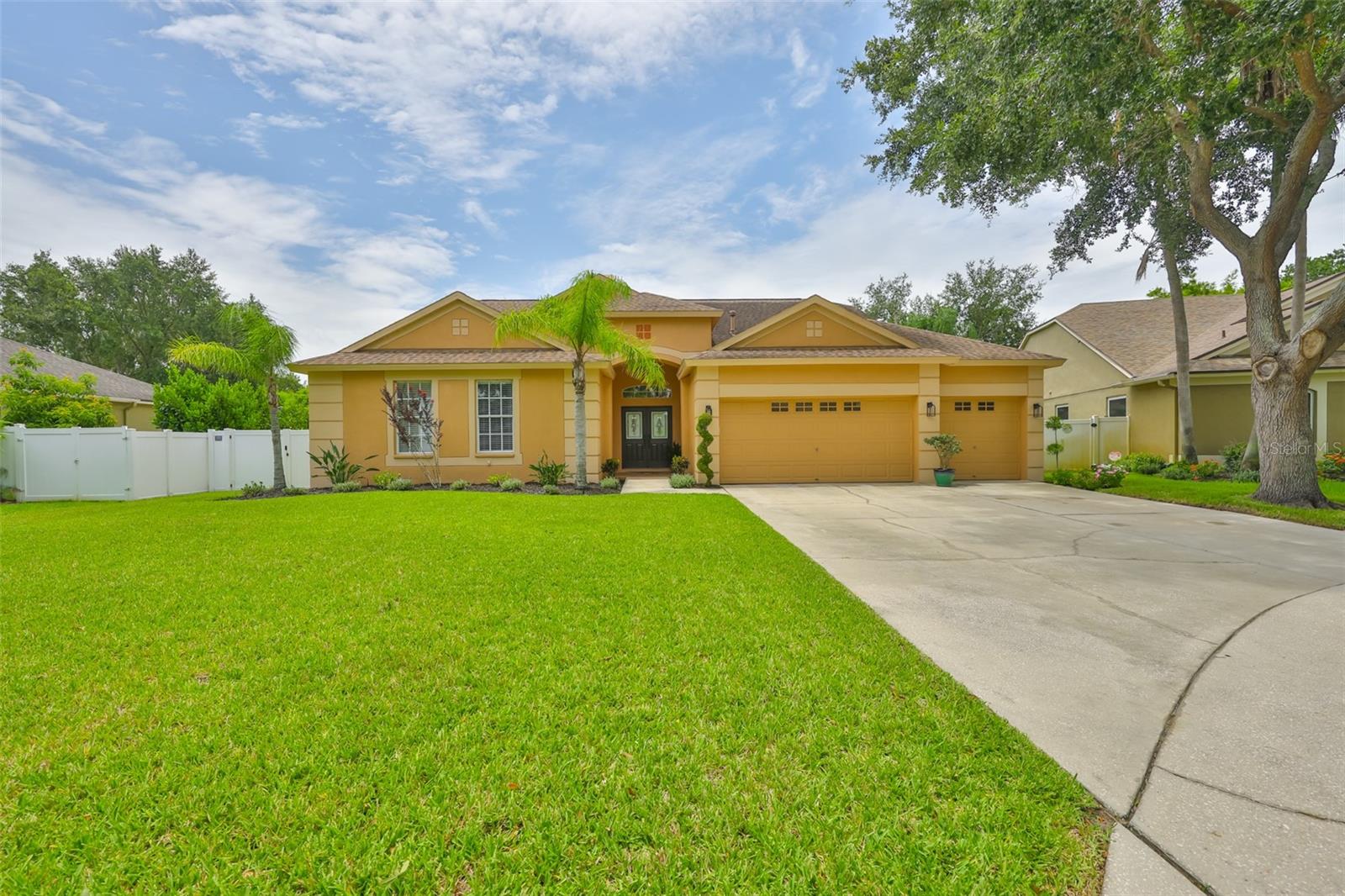 Welcome to the HIGHLY SOUGHT-OUT community of Riverwatch! This INCREDIBLE POOL HOME is nestled within a PRIVATE-GATED COMMUNITY. Close enough to Tampa for convenience, yet far enough to enjoy the peace and quiet of suburban living. With 3,001 square feet of living space, this spacious floor plan truly says, I am the one! Featuring 3 Car garage, 5 full bedrooms, 3 full bathrooms, and a half bath located in the upstairs bonus room (adding approximately 518 sq. ft. of private living space), this home offers flexibility for a variety of lifestyles. The floor plan is especially versatile, boasting (2) OWNER suites on the main level each accompanied by tastefully updated FULL bathrooms and flooring with tailored accents. 2019 NEW CUSTOM FRONT DOORS, 2024-2025 ALL NEW REMODELED BATHROOMS, NEW BASEBOARDS COMPLETED AND INSTALLED WITH ATTENTION TO DETAIL. Owner's Suite #1 showcases beautiful slate flooring, huge CUSTOM WALK-IN CLOSET and sliding glass doors leading directly to your private pool deck, creating the perfect retreat. Stylish WOOD FLOORING runs throughout the main floor, complemented by BRAND NEW TILE FLOORING in the foyer, setting a welcoming and elegant tone as you enter. Enjoy a spacious kitchen, gas stove cooking, perfect for meal prep and hosting large gatherings. Step out back to your private pool patio, ideal for relaxing or entertaining. The recent addition of TONGUE AND GROOVE PINE PANELING under the patio roof adds a warm, rustic charm that completes the outdoor oasis. Situated on a quiet CUL-DE-SAC under a serene canopy of mature trees, this home offers both privacy and tranquility. Making it a true gem in Riverwatch. Don't miss your chance to make this beautifully updated home your own!