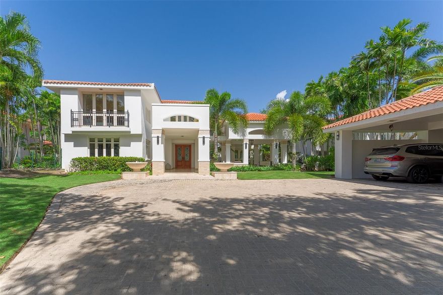 This magnificent Dorado Beach East home offers 7,229 total square feet, featuring 5,270 square feet of interior living space across two levels. In addition, you'll find 1,809 square feet of covered areas, including a porch, front and rear terraces, and a detached double car & golf cart garage. First Floor: En-suite master bedroom Dining room with an outdoor relaxation area Spacious living room Well-appointed kitchen with dining space Great room leading to the back terrace, pool, and outdoor kitchen Porch area for relaxation with a scenic lake view Upstairs: Large master bedroom with an office and storage space Expansive terrace overlooking the backyard and pool Two additional bedrooms Nestled on a 1,796 sq. m. lot, the beautifully landscaped backyard and private pool complete this exceptional property, offering the best value in Dorado Beach East.