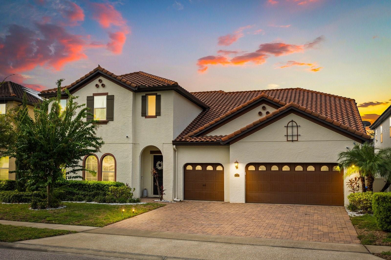Located in the highly sought-after Parkside community in Dr. Phillips, this Vizcaya model home by Meritage is exactly what you've been looking for. Situated in a prime location just off Apopka Vineland Road, near Universal Studios, Disney Springs, and I-4, you'll enjoy easy access to Dr. Phillips Marketplace and the renowned "Restaurant Row," both just minutes away. The home features elegant porcelain tile flooring throughout the foyer, dining room, living room, and family room. With 6 bedrooms and 4 bathrooms, this spacious residence includes a loft-style living area perfect for game nights, as well as a dedicated home theater. The primary bedroom is conveniently located on the main floor, and the laundry room is upstairs. The chef's kitchen is a culinary dream, equipped with stainless steel appliances, granite countertops, and a center island designed for entertaining. Step outside to an oversized lanai overlooking a tranquil pool, ideal for outdoor gatherings and parties. With a built-in sound system in the living room, partial solar power, and a spacious 3-car garage, this home truly offers the complete package.