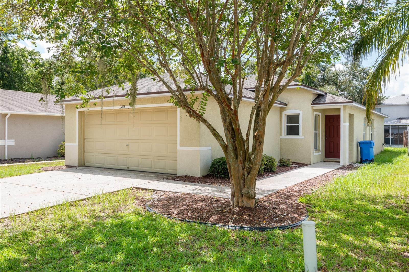 Don't miss out on this 3 BR/2 BA house with 2-car garage in Mango Groves! The entire house is outfitted with wood plank tile flooring. The spacious combination living and dining room flows into the newly renovated kitchen with white shaker cabinets, granite countertops, range with hood, French-door refrigerator, pantry and plenty of room for an island or breakfast table. The primary bedroom features a recently updated ensuite bathroom with step-in shower, as well as a walk-in closet. The other two bedrooms share the (also just redone) hall bathroom. Washer and dryer inside. The 2-car attached attached garage has plenty of room for storage as well.
