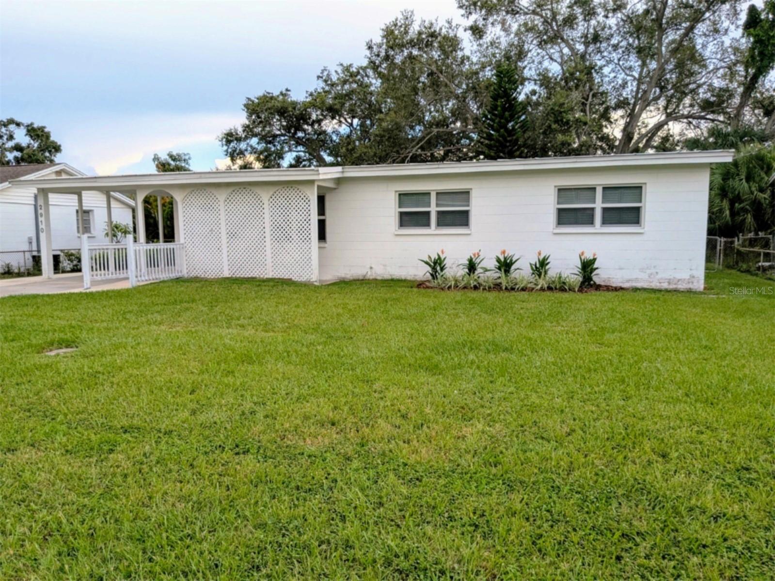 Great block home in excellent location! This single story block home is on a HUGE double lot, with plenty of room to expand. This gem needs a little TLC, and has amazing potential! The seller is offering this home AS-IS for convenience. The fully fenced back yard has plenty of room for family gatherings and pets to play. Inside you'll find 3 bedrooms, 2 baths, a living room, an inside laundry room and an enormous great room. The home offers a carport and detached 2-car garage which could easily be converted into an in-law apartment, and a large screened lanai. The backyard is stunning, offering plenty of room for a pool. This home is approximately two blocks from Bayshore Blvd, close to restaurants, transit and shopping. Call for your personal tour and make this home yours today!