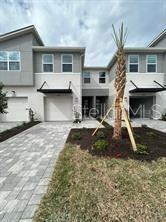Like new spacious townhome with kitchen upgrades, quartz countertops, stainless steel appliances, and 42" cabinetry. the Marianna floorplan has a spacious open living area with attached screeded lanai, featuring pavered tile flooring that has a serene view over the well-kept pond area. An attached one car garage enters right into the kitchen for convenience. The open living area with high ceilings, has luxury vinyl wood-look flooring and big sliding glass doors opening to the lanai. Upstairs, the primary bedroom is separate from the other two bedrooms offers a large walk-in closet, ensuite bathroom with double sinks and an oversized shower enclosure. just off of the primary bedroom is a large loft area that is perfect for relaxing office-study or play area. The secondary bedrooms feature large closets and share a large bathroom with separate linen closet. This home has an abundance of storage areas and fabulous outdoor living space. The home is wired with the latest in Smart Home technology and energy efficient double pane windows. The Volanti community is gated with a large, heated pool, BBQ area and outdoor firepit. The convenient location is close to I-75, The Tampa Premium Outlet mall and more. You have many choices for shopping dining and more with Wiregrass Mall and The Groves nearby. You will truly want to make this your home! Qualified, long term tenants are welcome to apply.